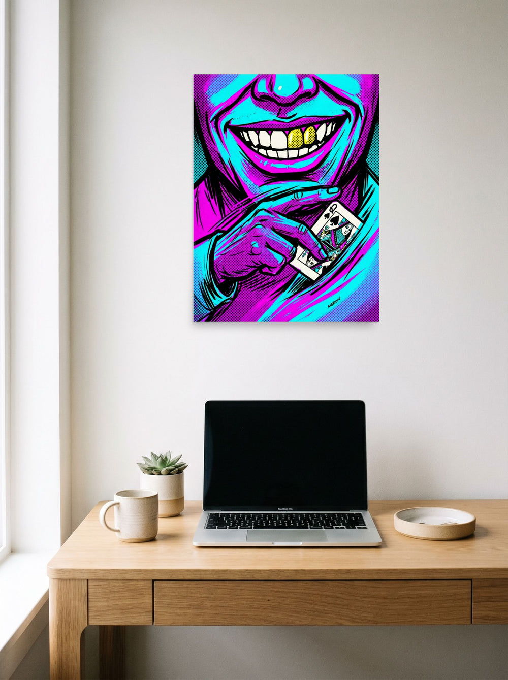 A 18x24 inch unframed paper Pop art print of 'Queen of Spades' hanging above a worktable with a laptop.
