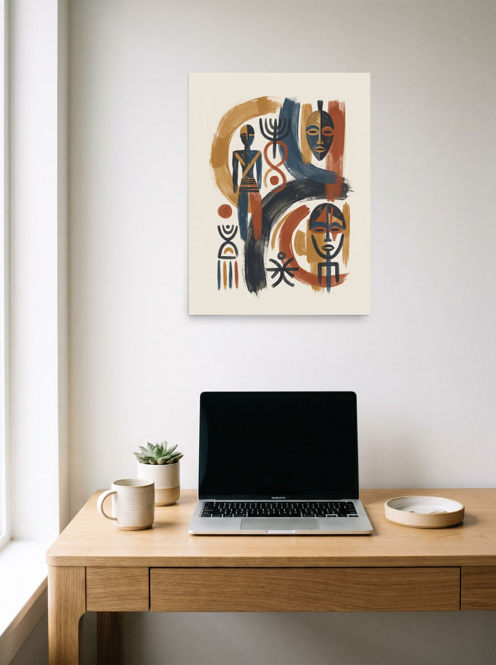A 18x24 inch unframed paper Abstract art,Modernism print of 'Ancestral Rhythms' hanging above a worktable with a laptop.