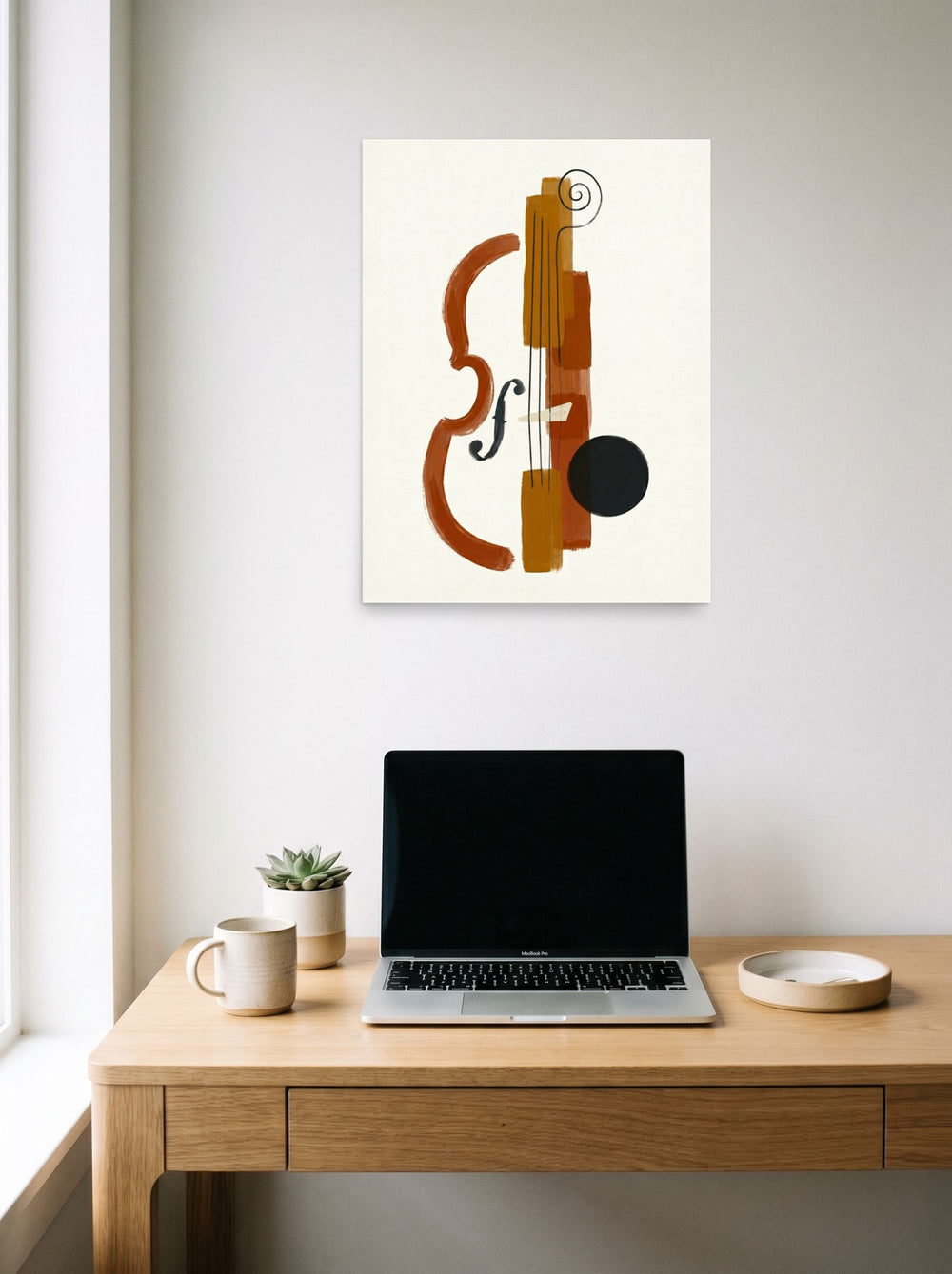 A 18x24 inch unframed paper Minimalism print of 'Symphony in Fragments' hanging above a worktable with a laptop.