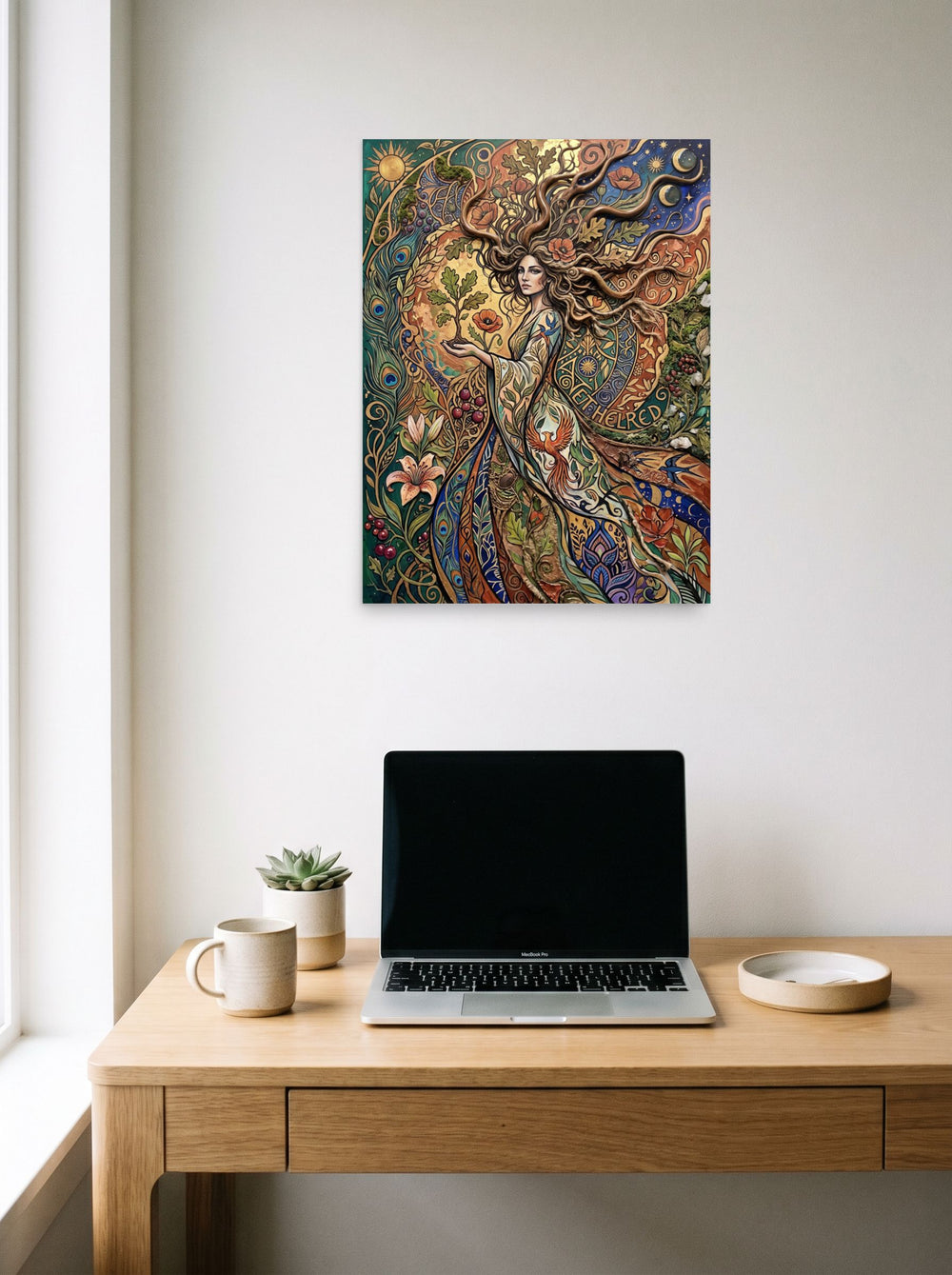 The unframed paper print 'Goddess of the Sacred Oak' hanging above a worktable with a laptop, shown at 18x24 inch.
