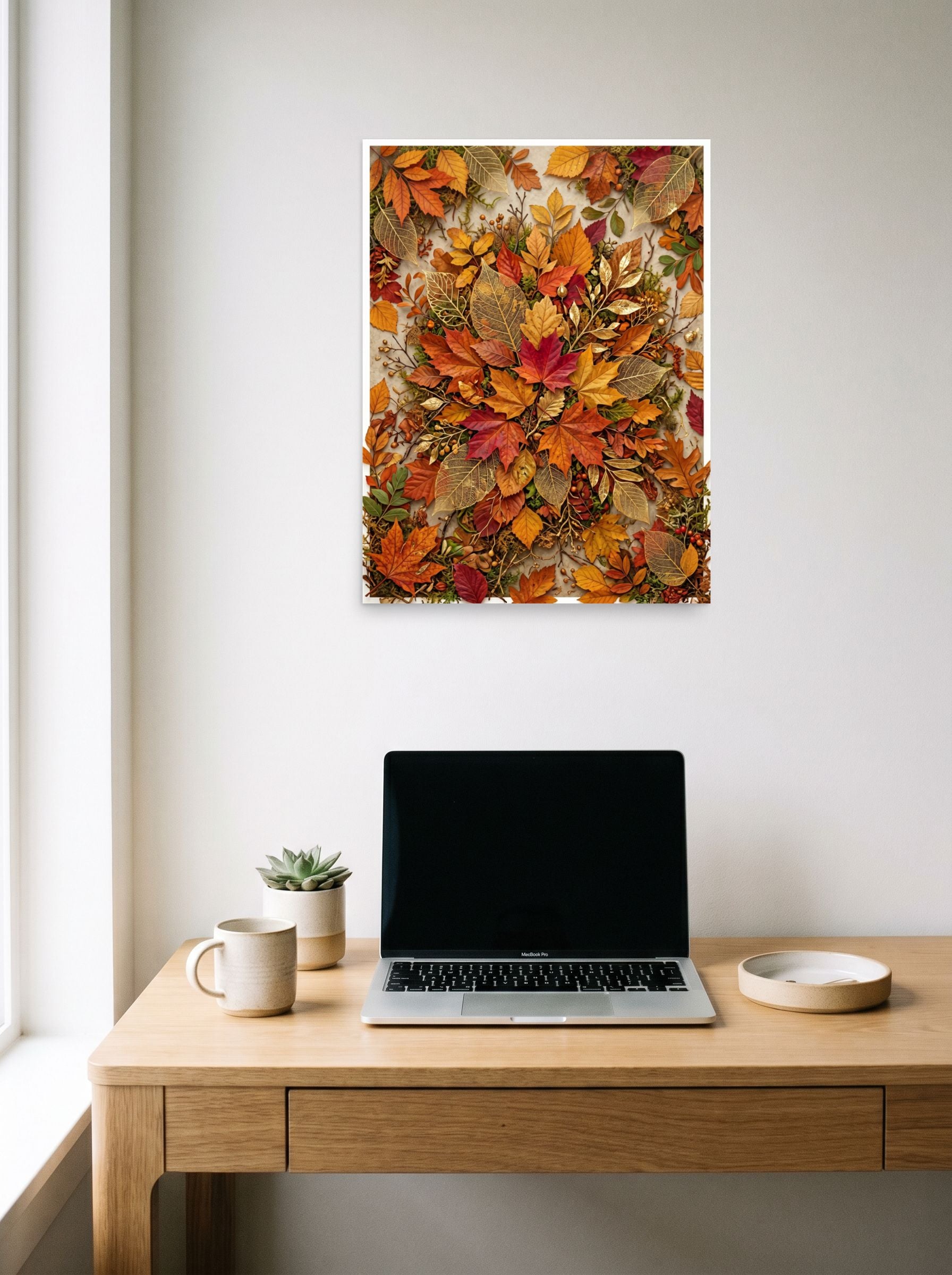 A 18x24 inch unframed paper Assemblage,Realism print of 'Autumn Tapestry' hanging above a worktable with a laptop.