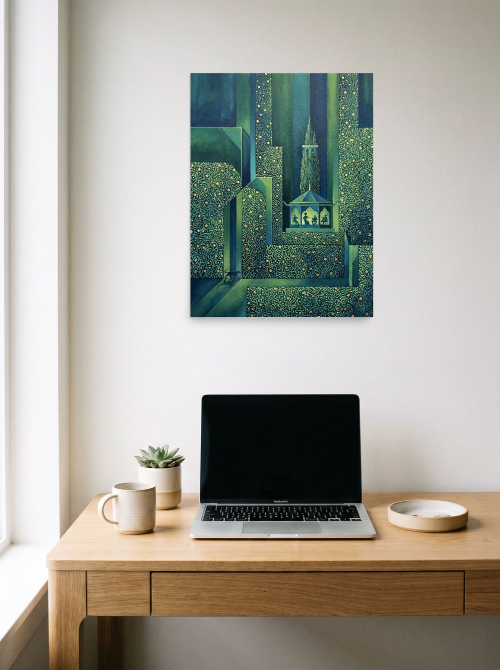 A 18x24 inch unframed paper Art Deco print of 'Starlight Serenade' hanging above a worktable with a laptop.