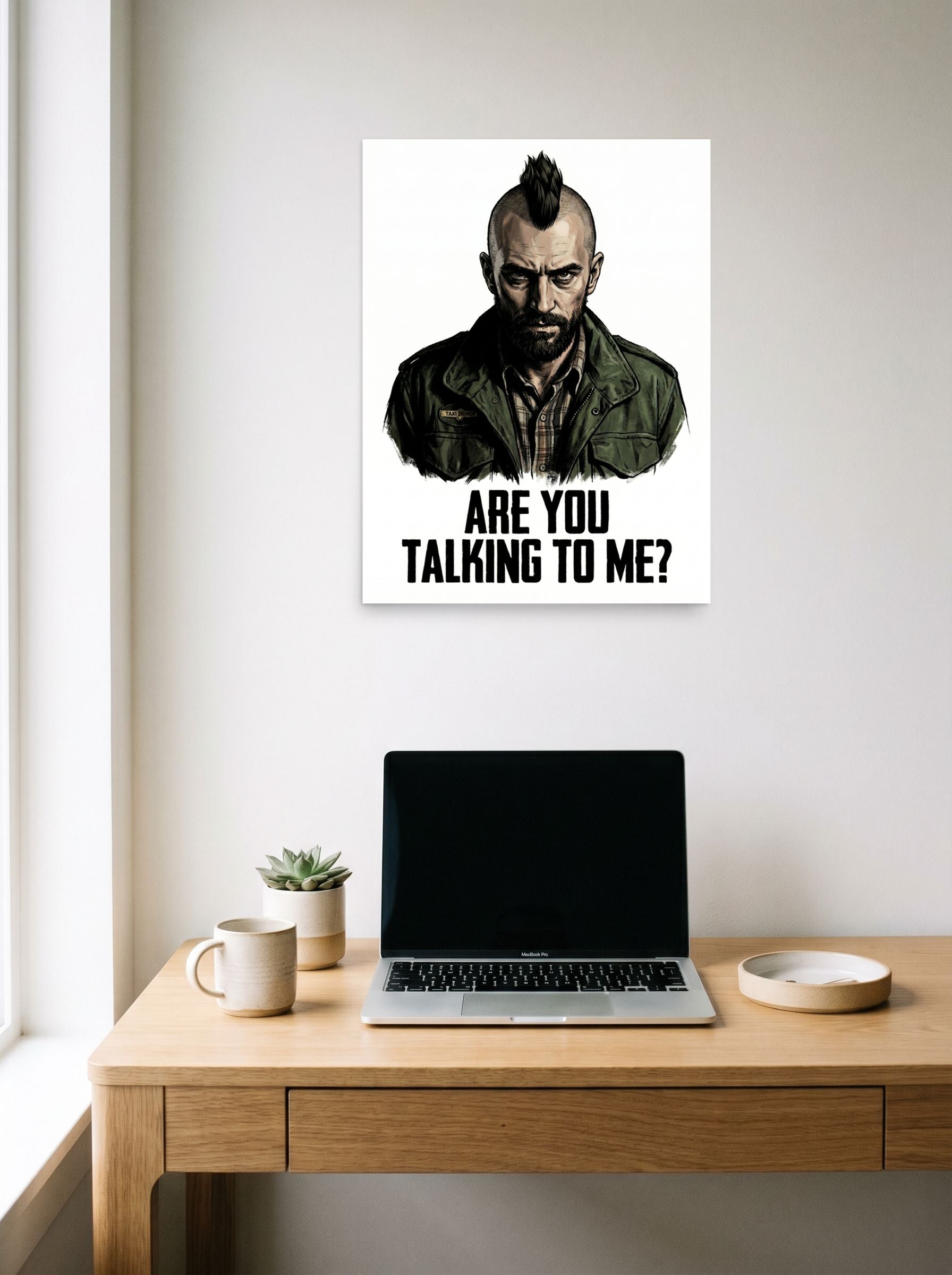 A 18x24 inch unframed paper Pop art,Digital art print of 'Talking to Me' hanging above a worktable with a laptop.