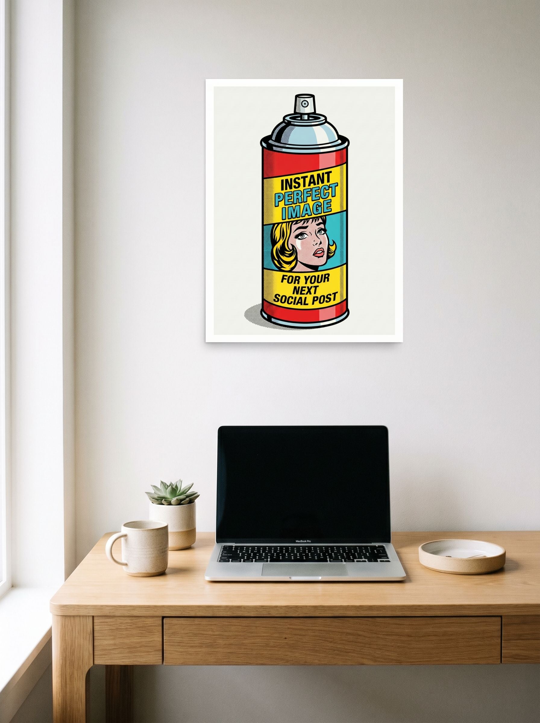 A 18x24 inch unframed paper Pop art print of 'Canned Perfection' hanging above a worktable with a laptop.