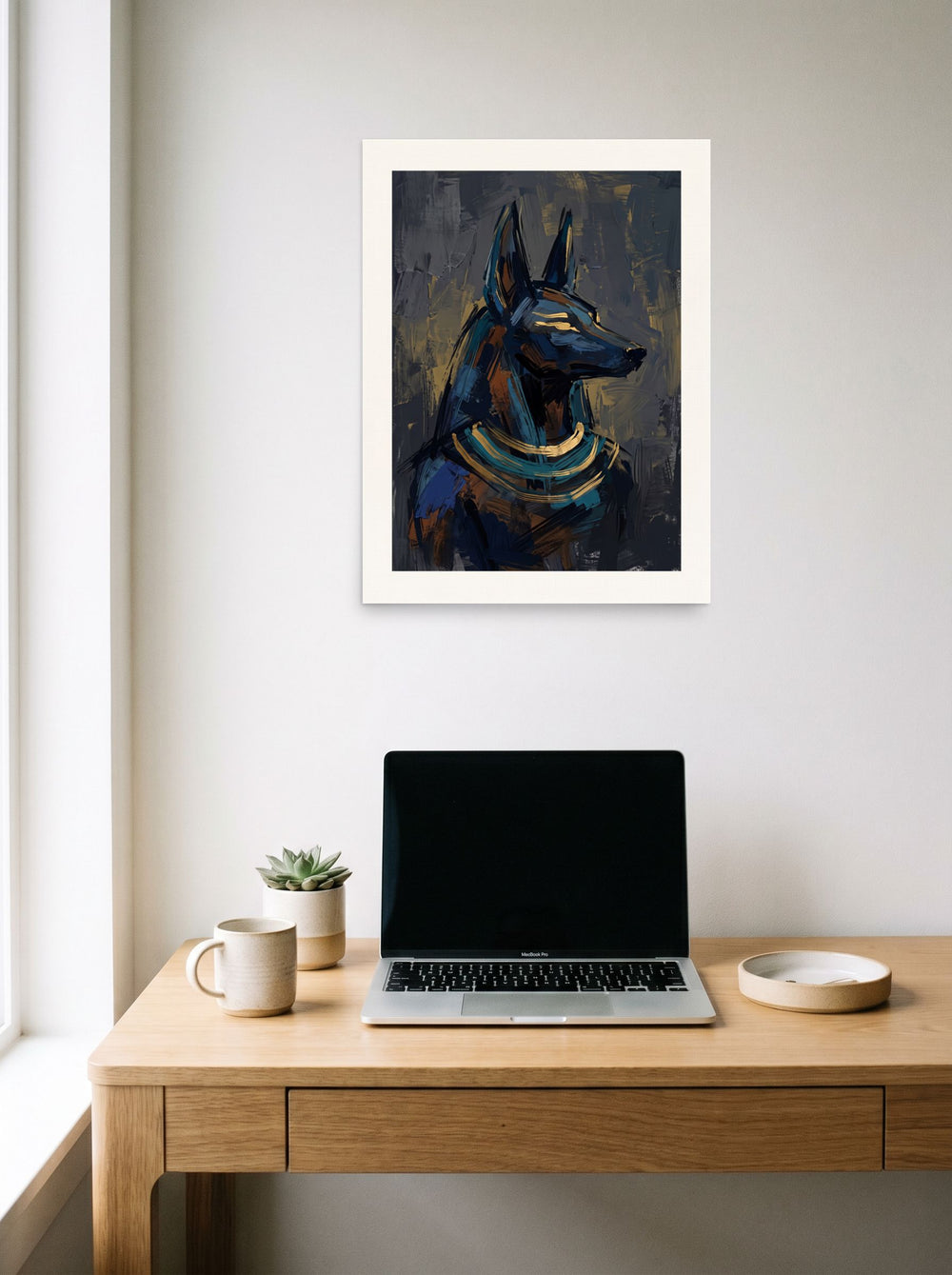 See 'The Jackal's Gaze' as a unframed paper print (18x24 inch), hanging above a worktable with a laptop.