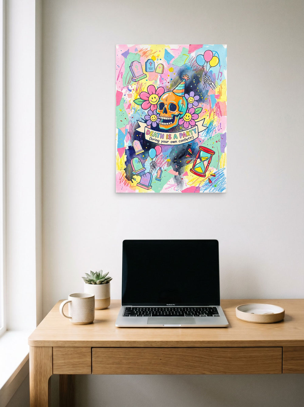 See 'Death is a Party' as a unframed paper print (18x24 inch), hanging above a worktable with a laptop.