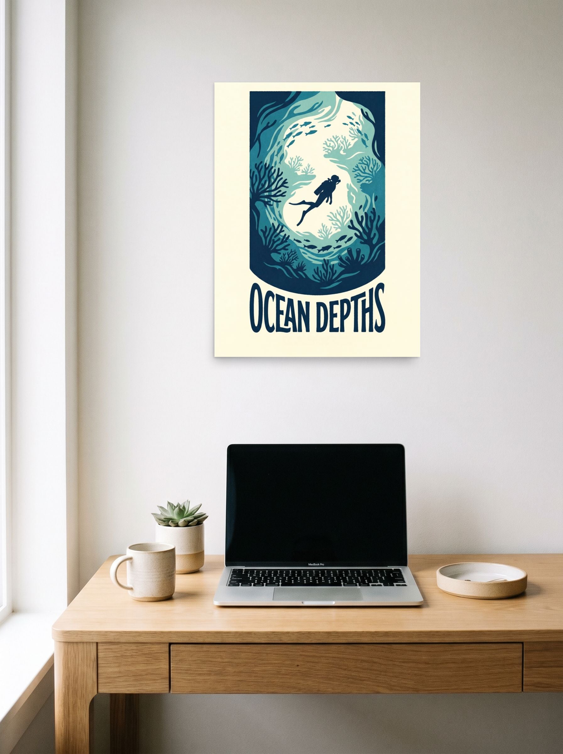 A 18x24 inch unframed paper Digital art,Minimalism print of 'Into the Deep Blue' hanging above a worktable with a laptop.