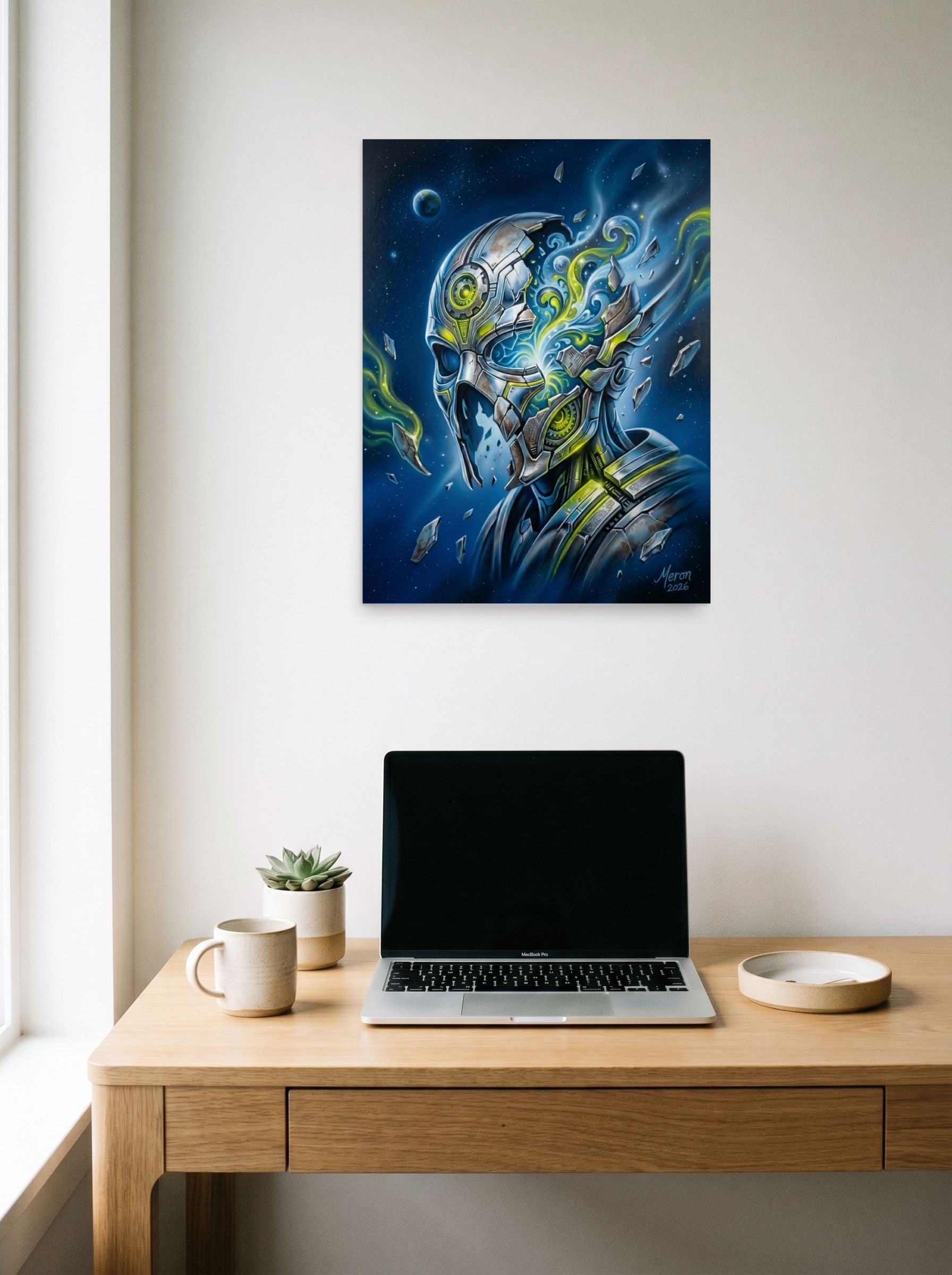 A 18x24 inch unframed paper Surrealism print of 'Shattered Automaton' hanging above a worktable with a laptop.
