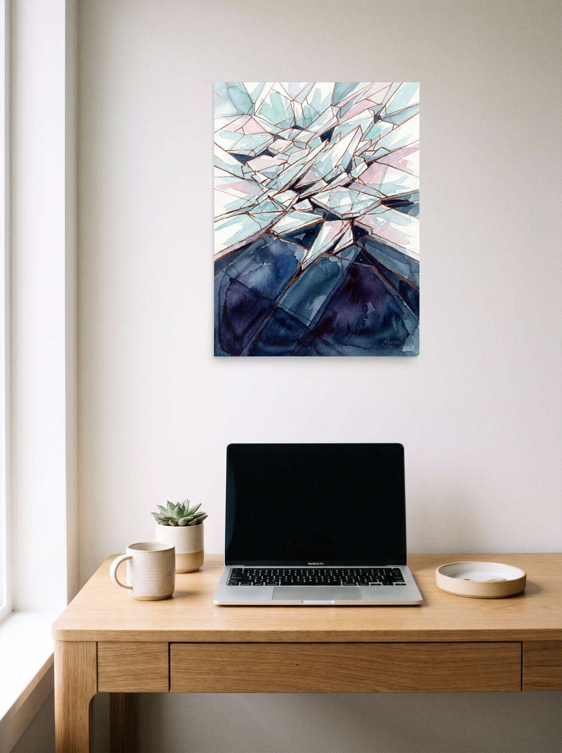 A 18x24 inch unframed paper Expressionism print of 'Coastal Thunderstorm' hanging above a worktable with a laptop.
