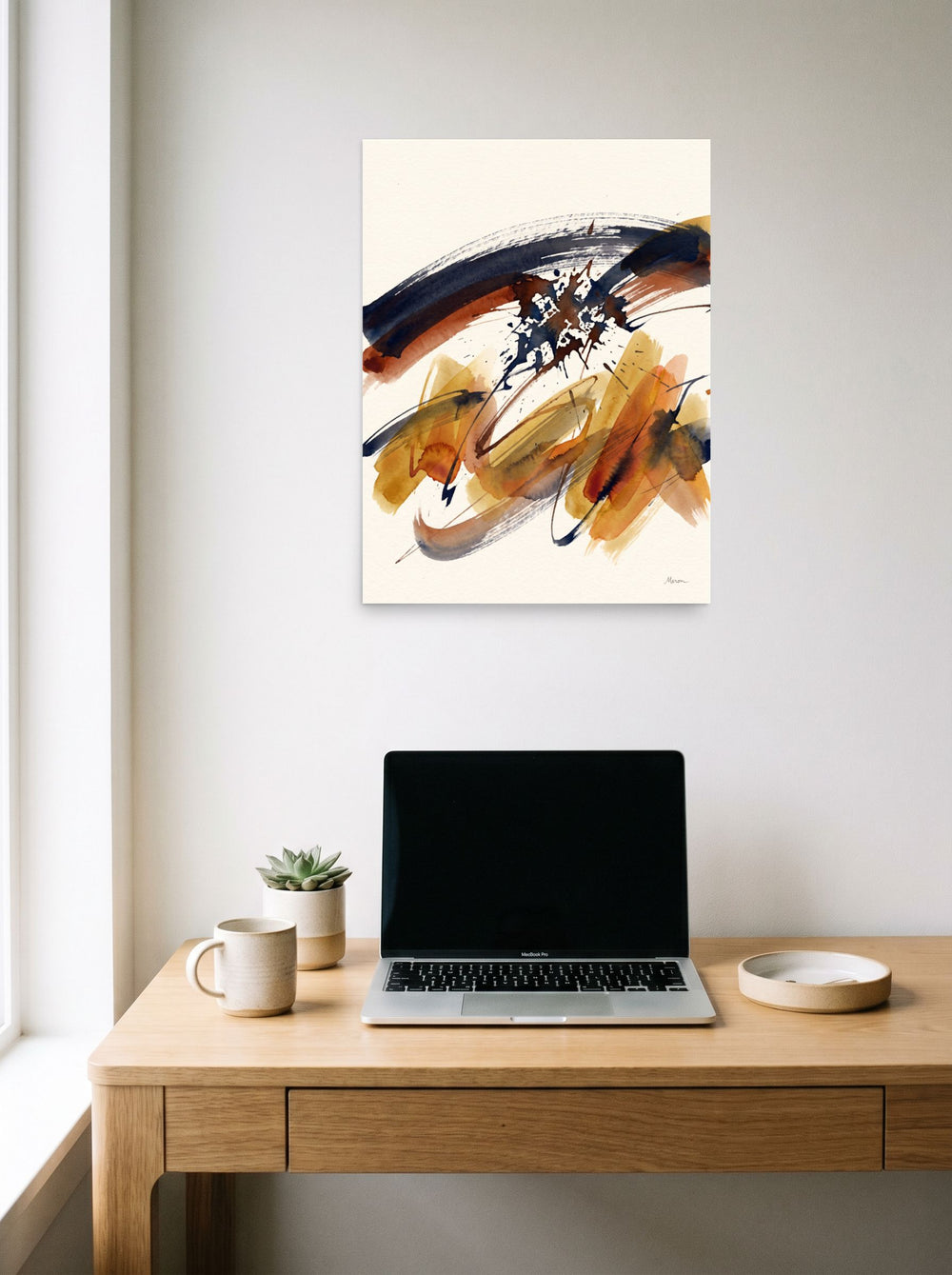 'Sienna Momentum' hanging above a worktable with a laptop. A 18x24 inch unframed paper Abstract art print.