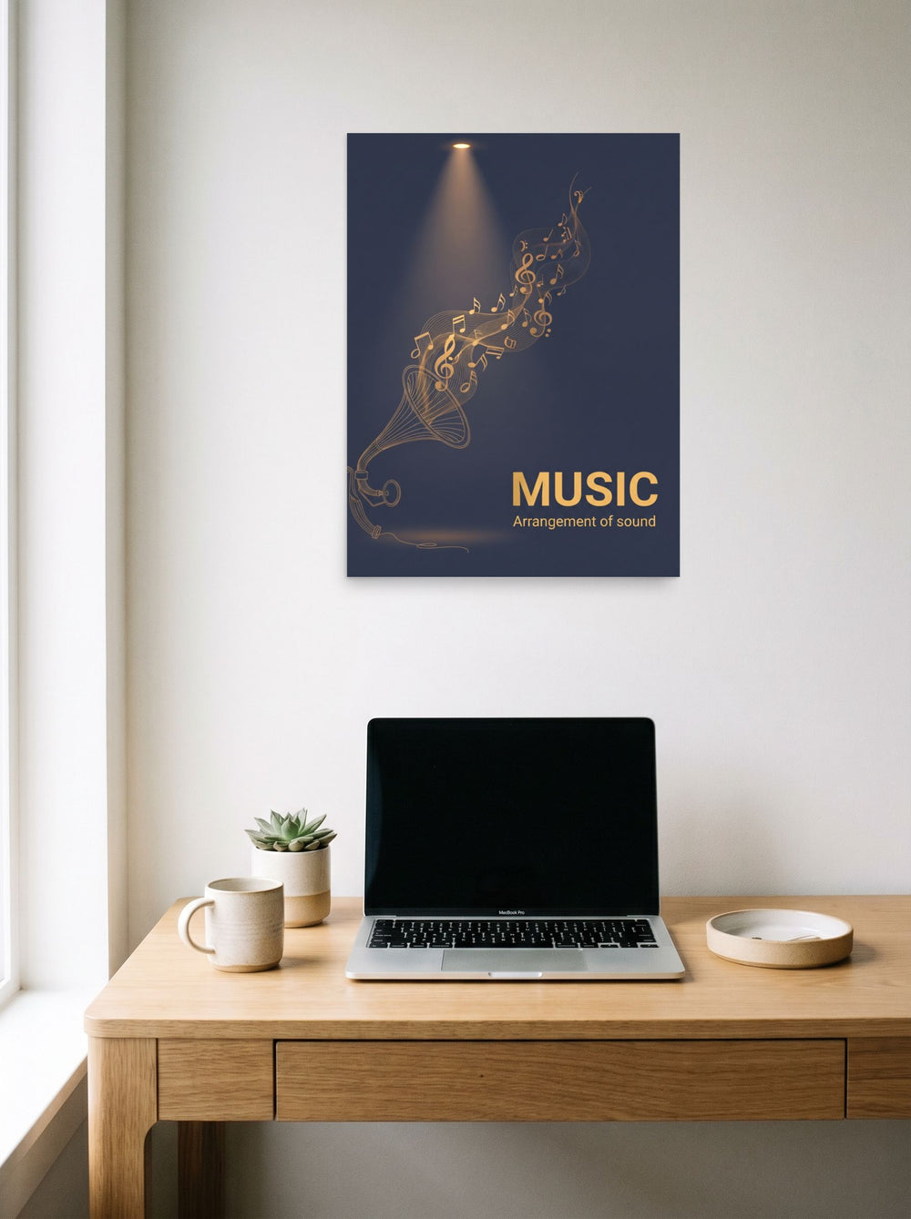 A 18x24 inch unframed paper Art Deco print of 'Golden Melody' hanging above a worktable with a laptop.
