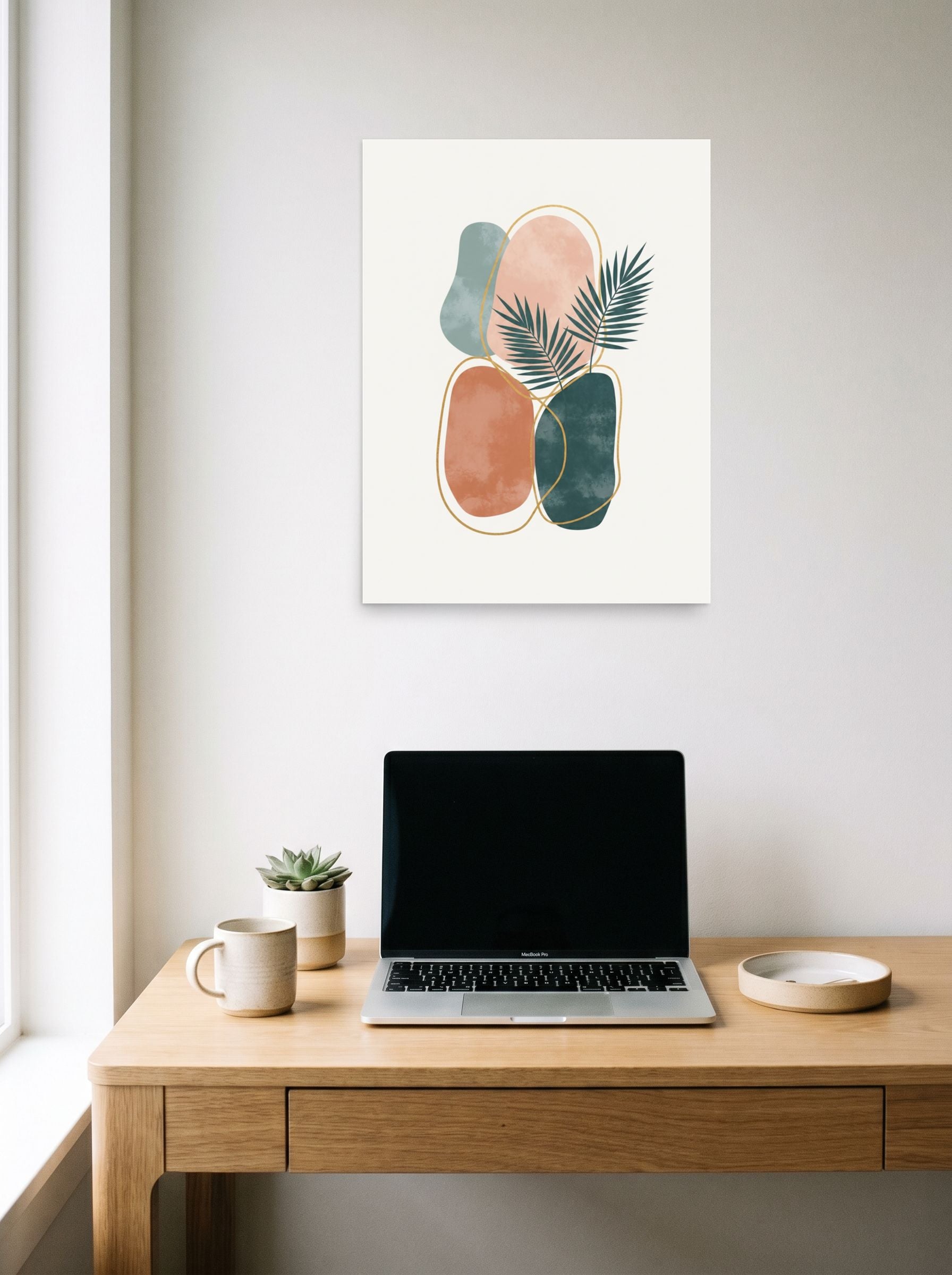 A 18x24 inch unframed paper Minimalism print of 'Tropical Abstract Harmony' hanging above a worktable with a laptop.