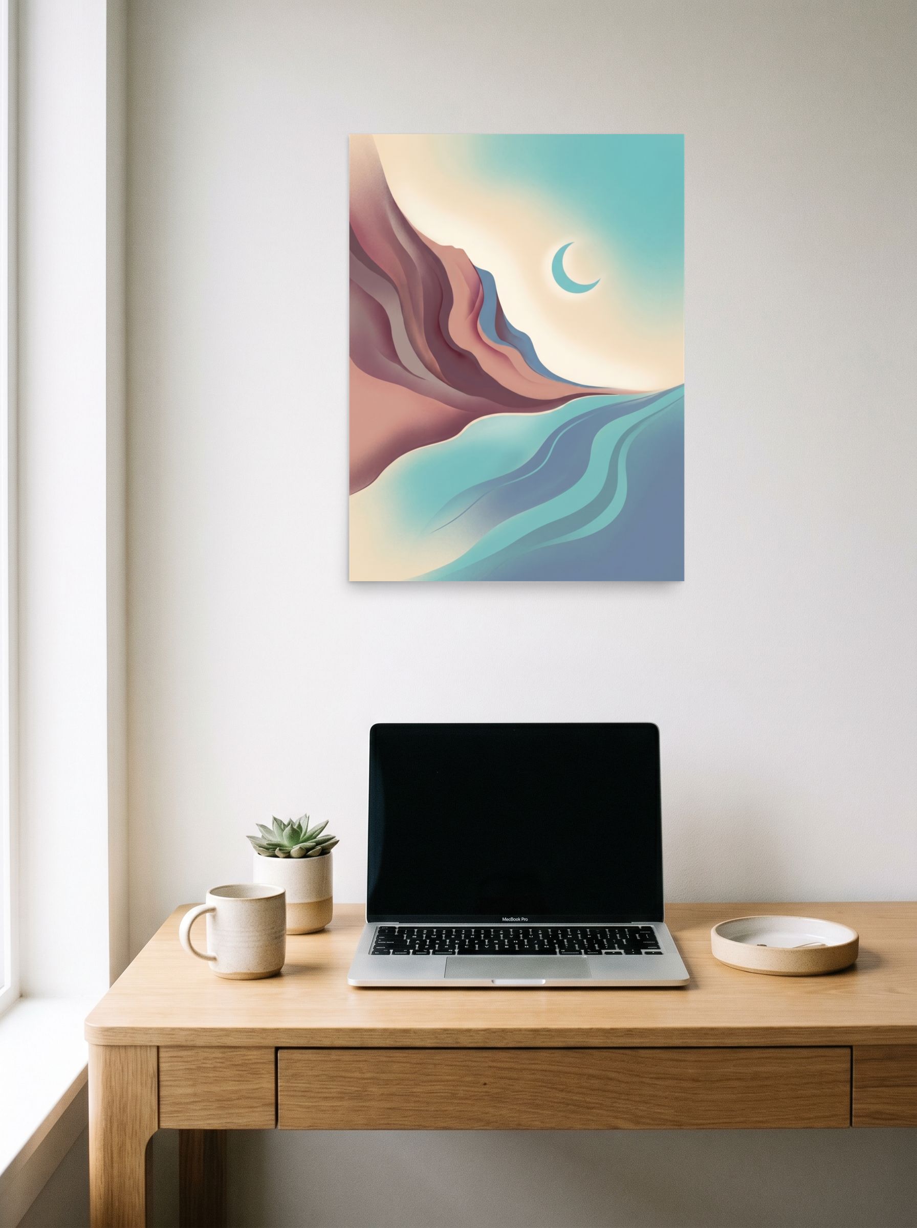 A 18x24 inch unframed paper Minimalism print of 'Canyon Moonrise' hanging above a worktable with a laptop.
