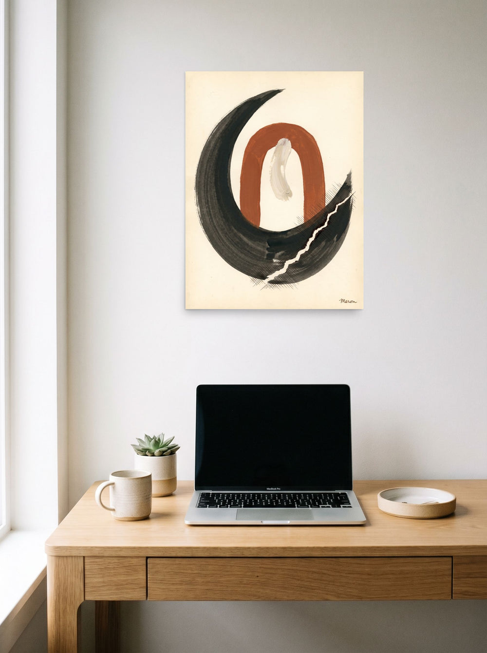The unframed paper print 'Earthen Crescent' displayed over a compact desk setup, shown at 18x24 inch.