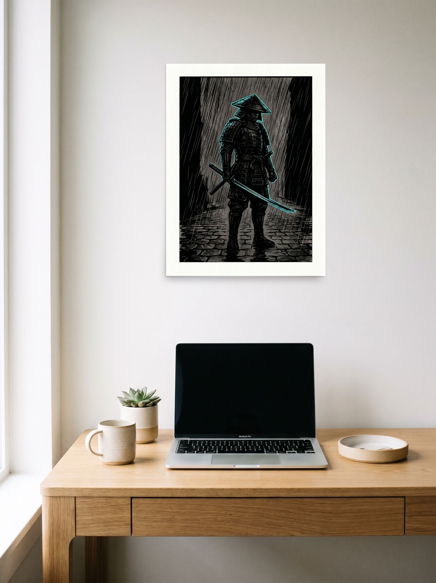 A 18x24 inch unframed paper Ukiyo-e,Retrofuturism print of 'Cyber Samurai in the Rain' hanging above a worktable with a laptop.