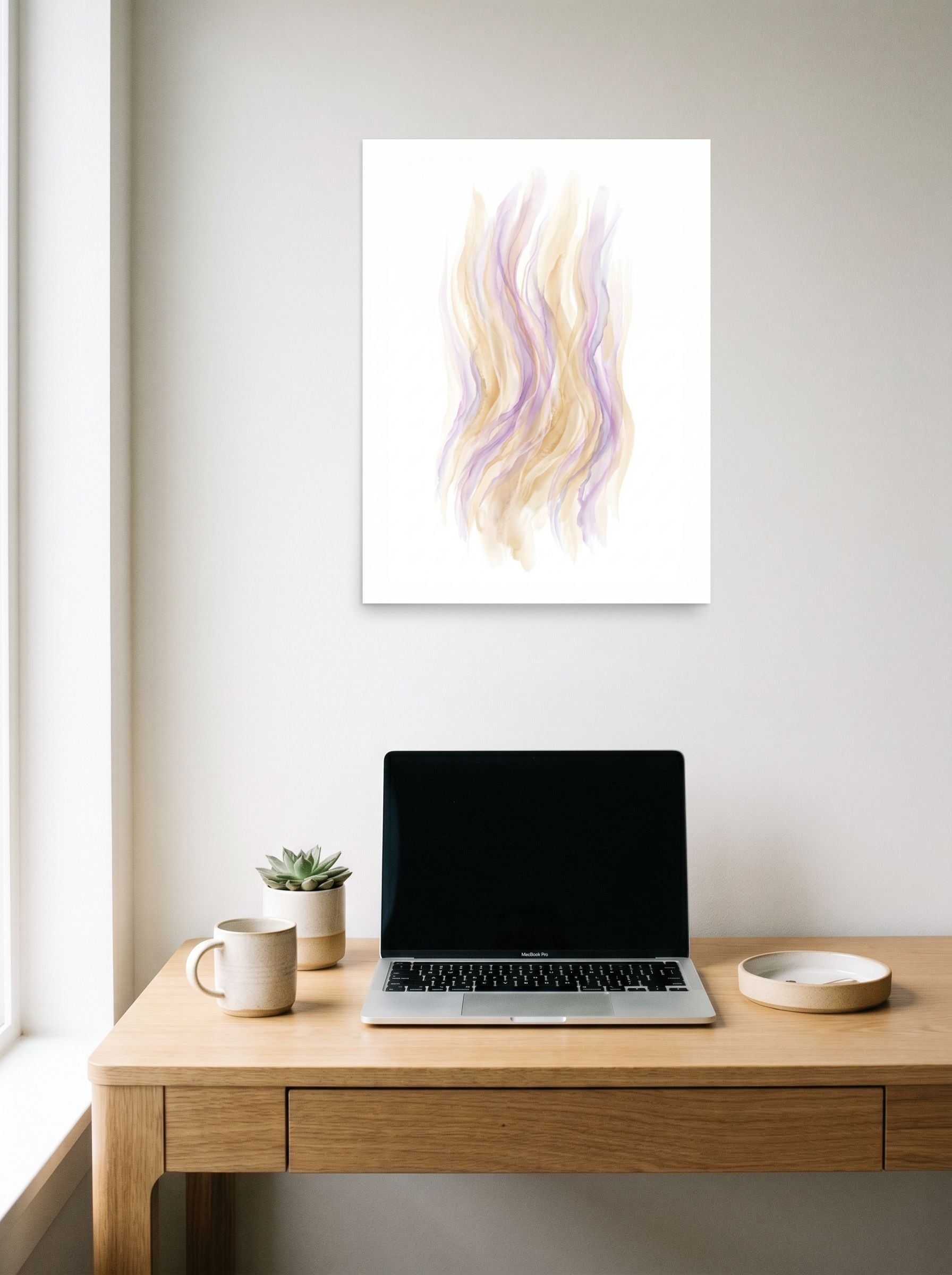 A 18x24 inch unframed paper Abstract art,Lyrical abstraction print of 'Pastel Whispers' hanging above a worktable with a laptop.