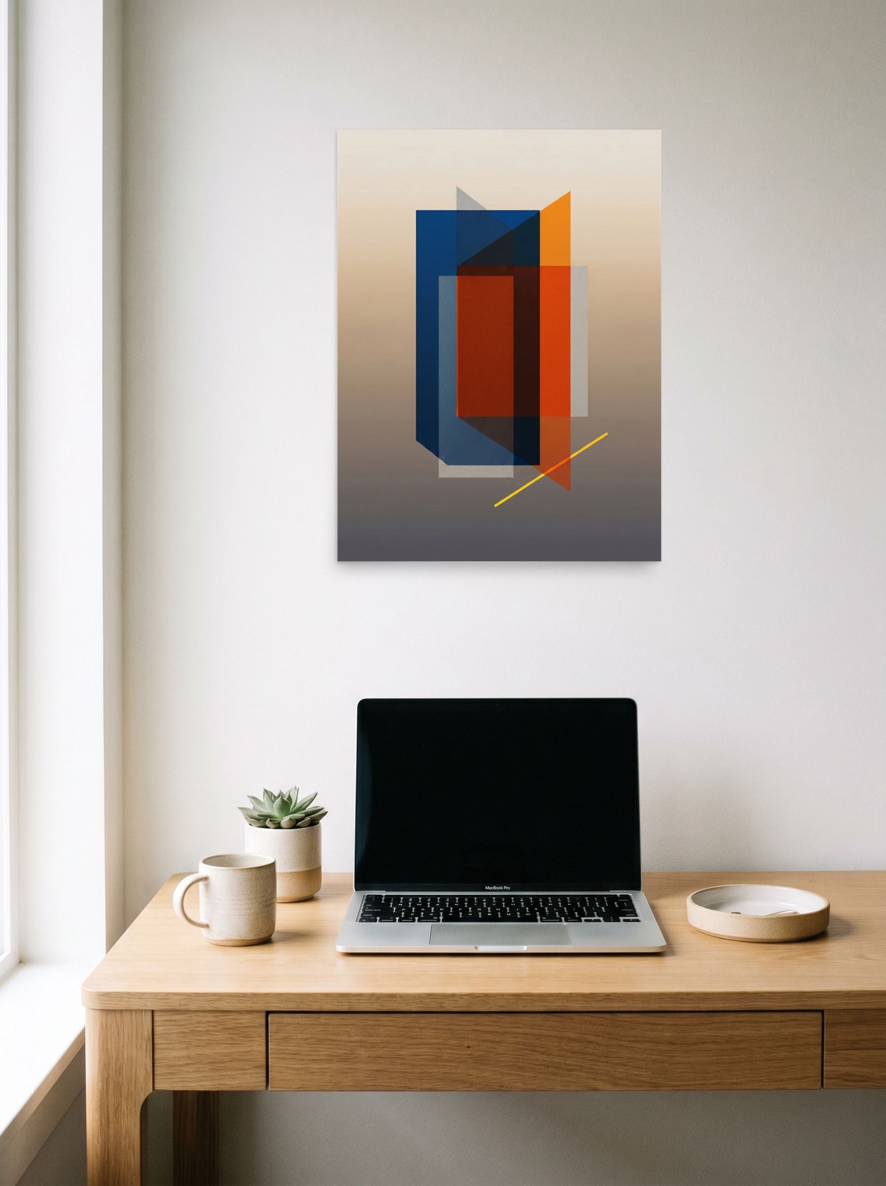 A 18x24 inch unframed paper Minimalism,Geometric abstract art print of 'Translucent Intersections' hanging above a worktable with a laptop.