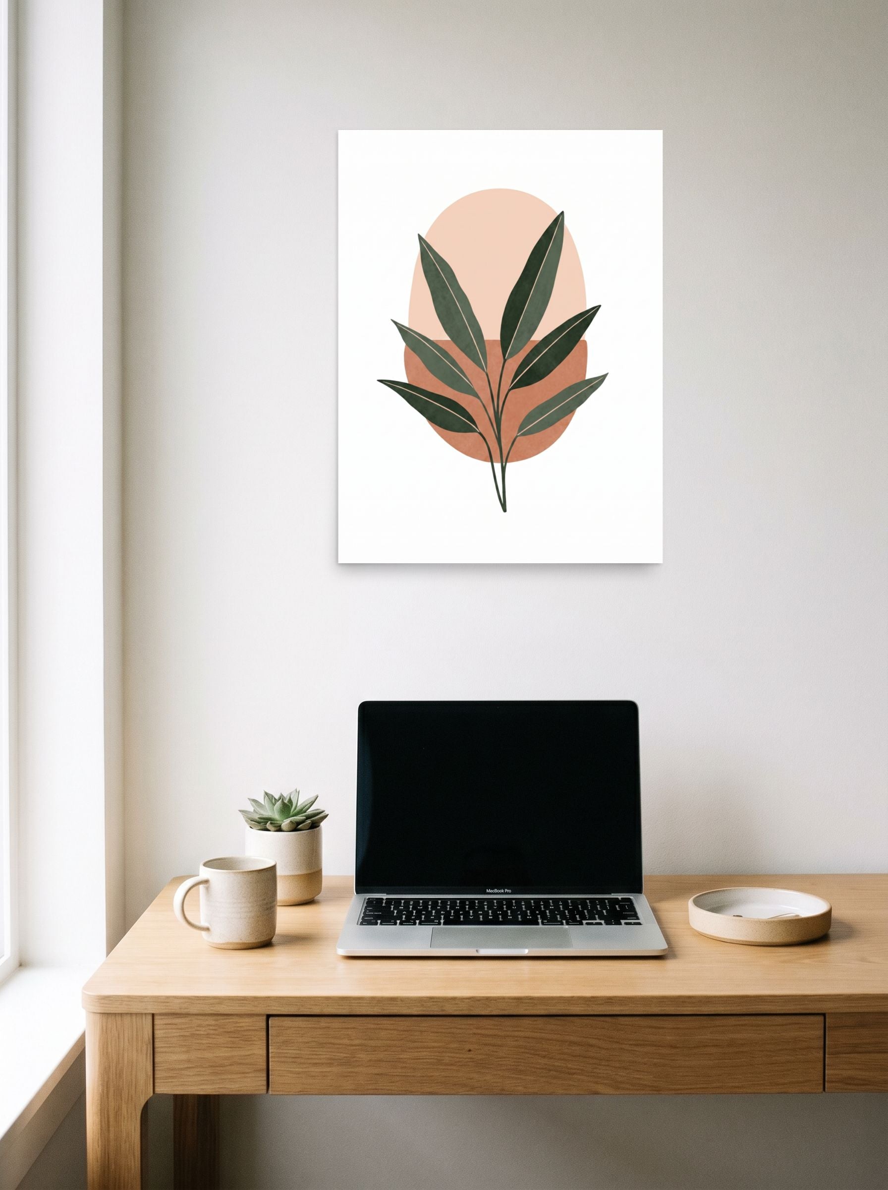 A 18x24 inch unframed paper Minimalism print of 'Botanical Horizon' hanging above a worktable with a laptop.