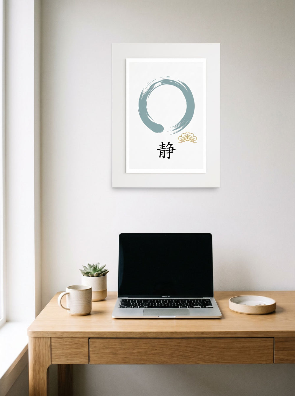 A 18x24 inch unframed paper version of 'Circle of Stillness', Shin hanga wall art, hanging above a worktable with a laptop.