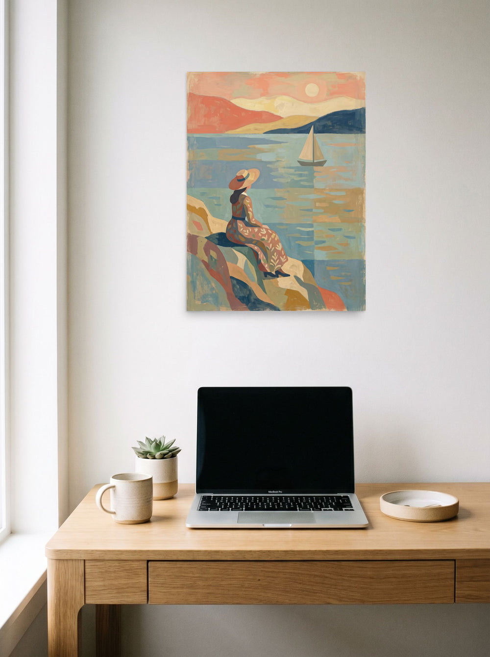 'Coastal Reverie' in 18x24 inch unframed paper, hanging above a worktable with a laptop.