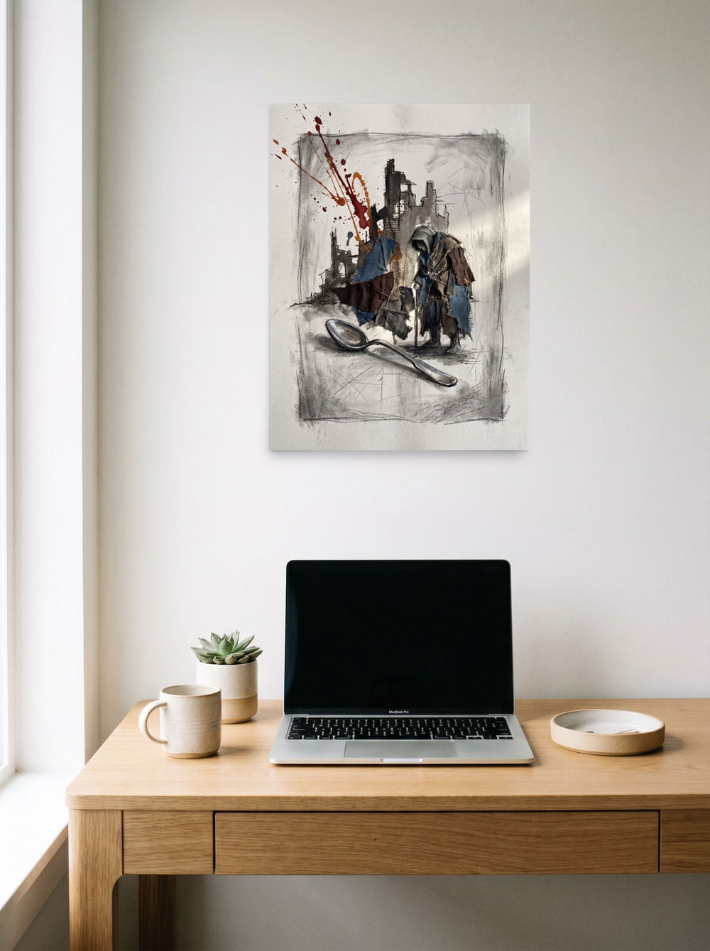 'The Weight of the Spoon', a Transgressive art print hanging above a worktable with a laptop. Shown as unframed paper, 18x24 inch.