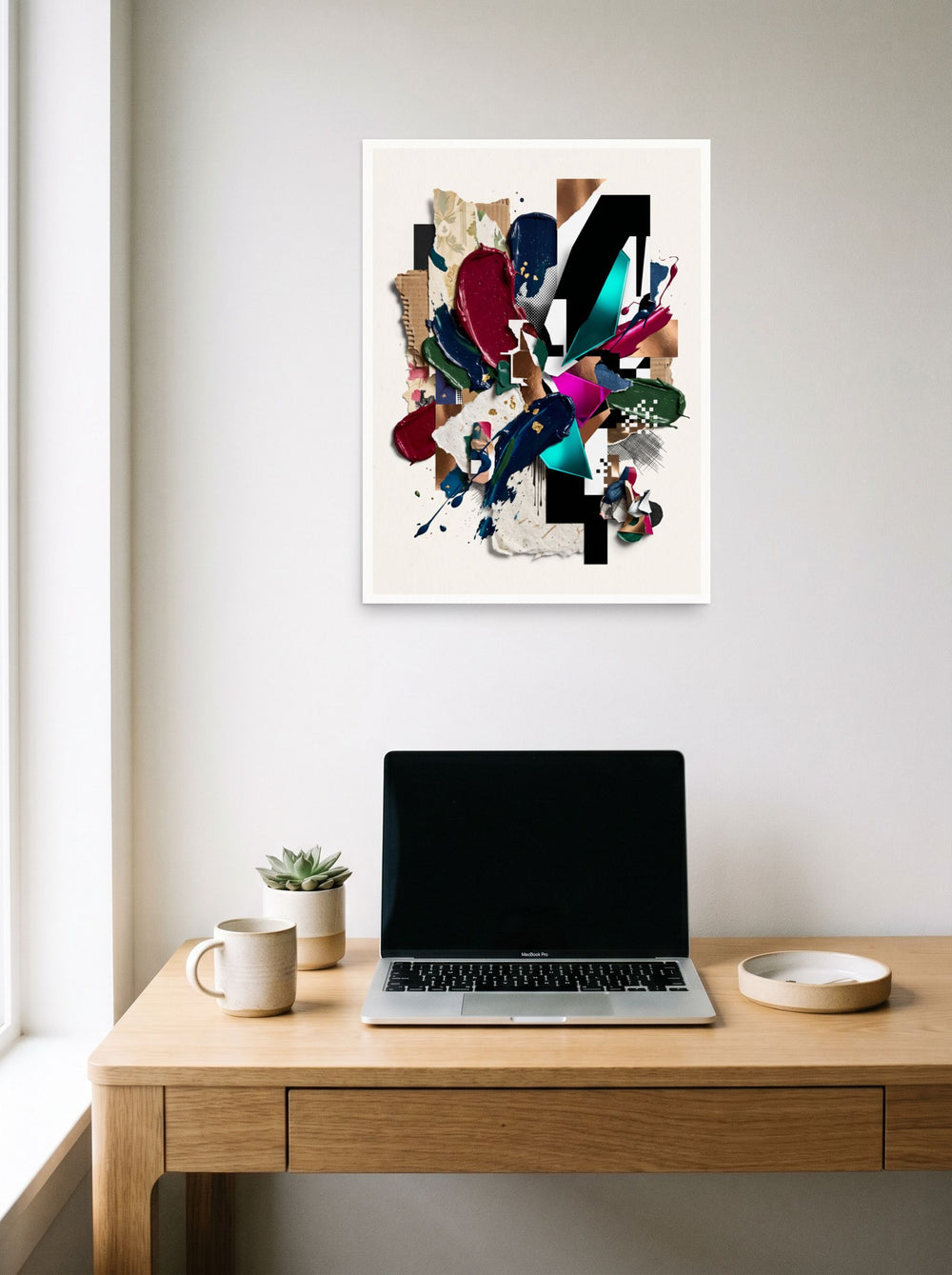 A unframed paper print of the Assemblage artwork 'Geometric Synthesis', styled above a home-office workspace.