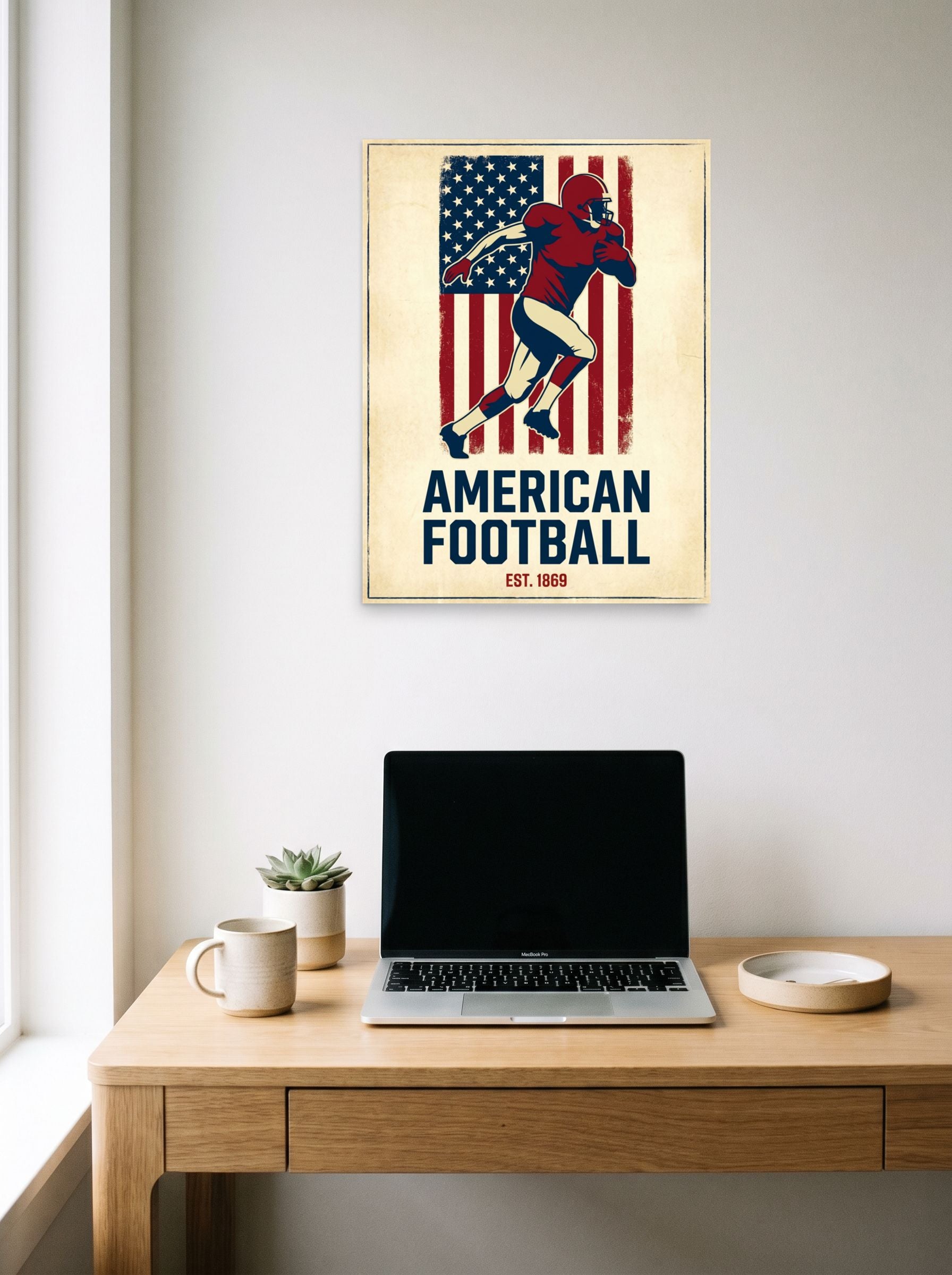 A 18x24 inch unframed paper Pop art,Digital art print of 'Gridiron Heritage' hanging above a worktable with a laptop.