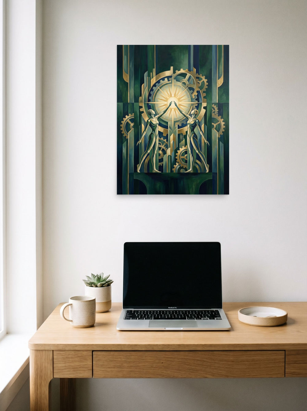 A 18x24 inch unframed paper Art Deco print of 'The Mechanical Dawn' hanging above a worktable with a laptop.
