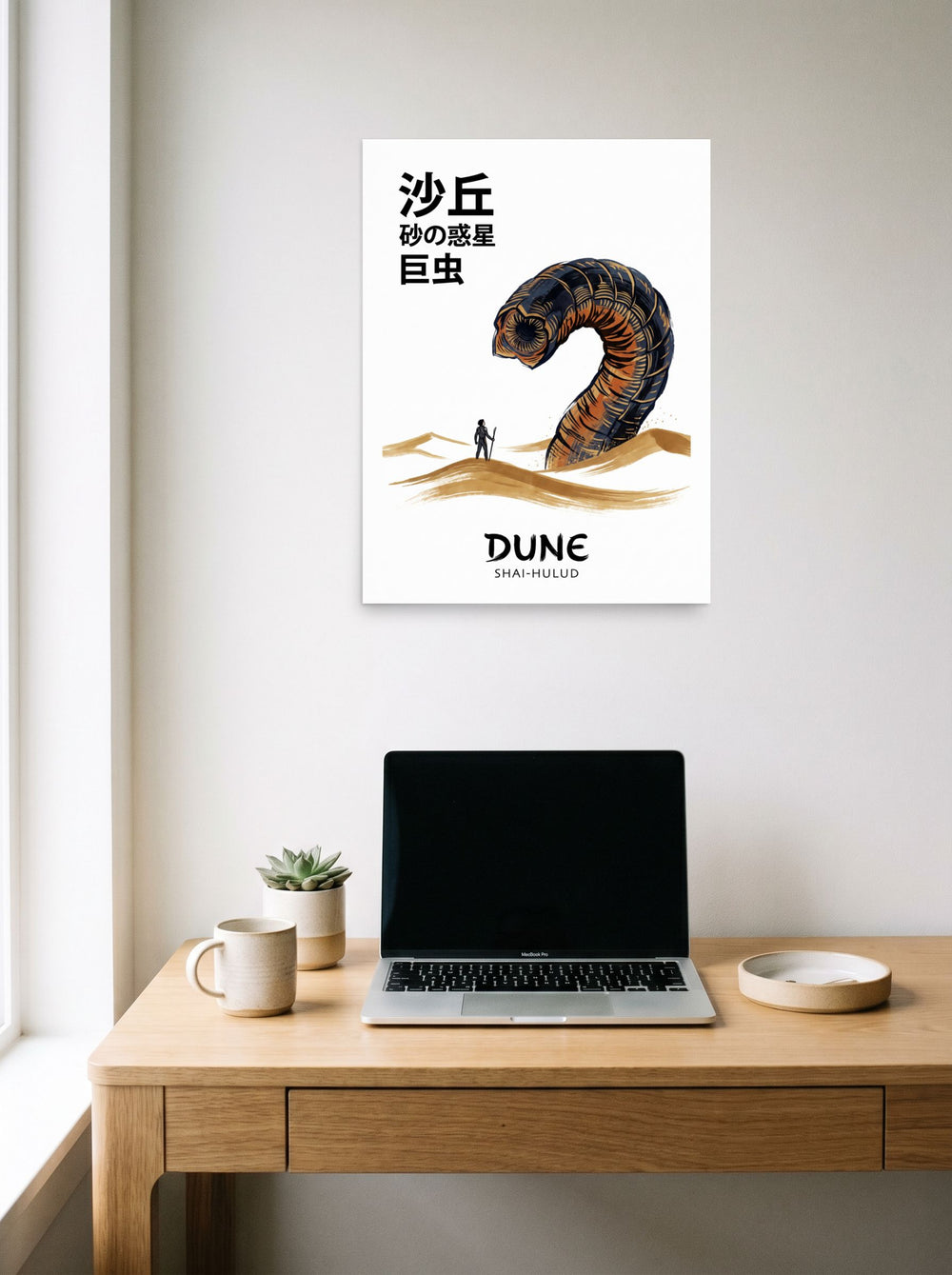 A 18x24 inch unframed paper Pop art,Japanese art print of 'Lord of the Desert' hanging above a worktable with a laptop.