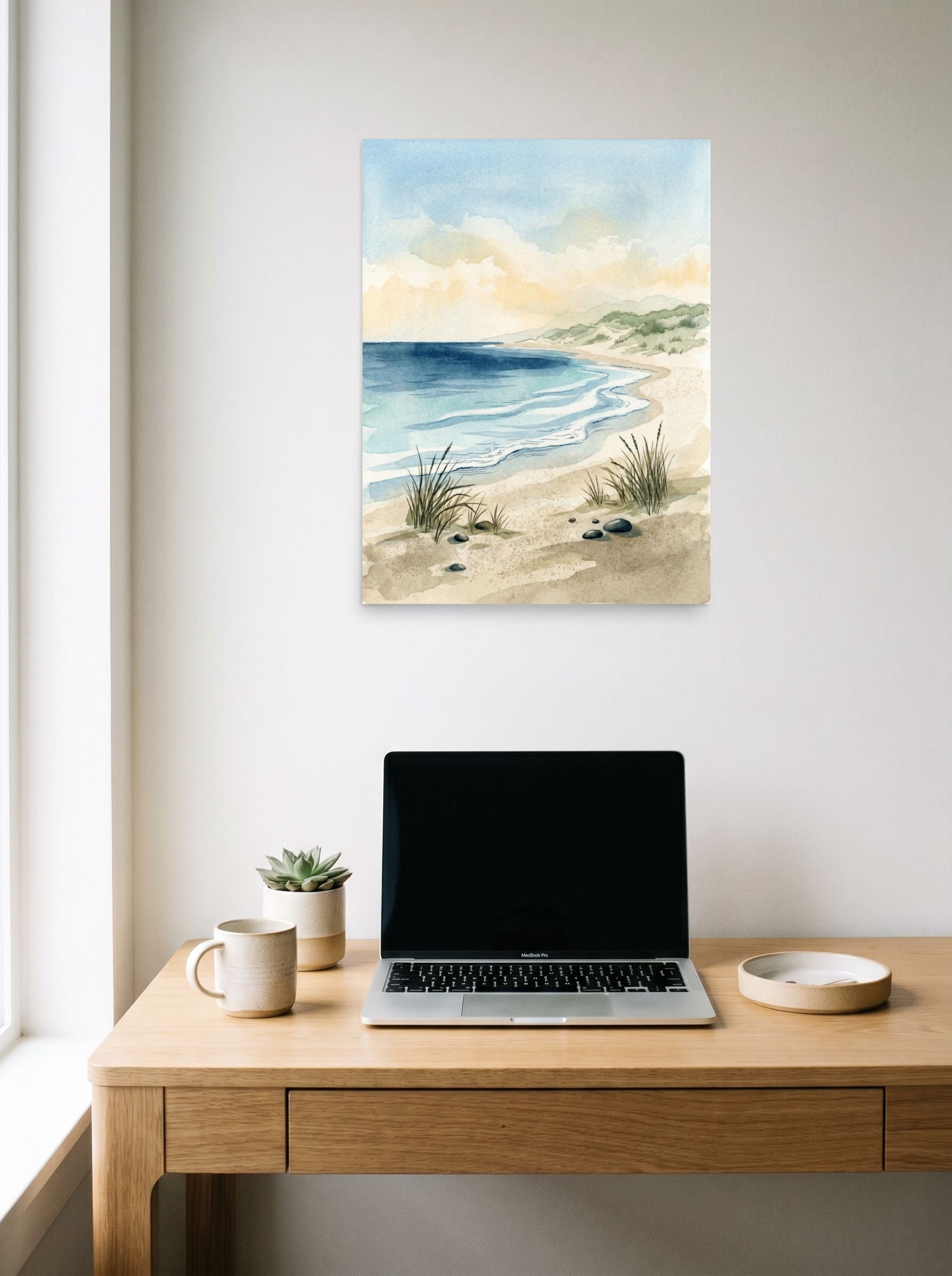 A 18x24 inch unframed paper Impressionism print of 'Tranquil Tides' hanging above a worktable with a laptop.
