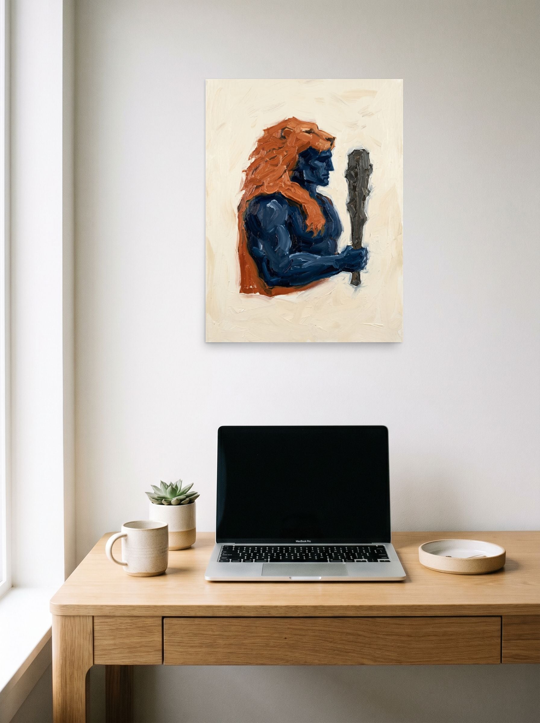 A 18x24 inch unframed paper Neo-expressionism,Figurative art print of 'Hercules's Mantle' hanging above a worktable with a laptop.