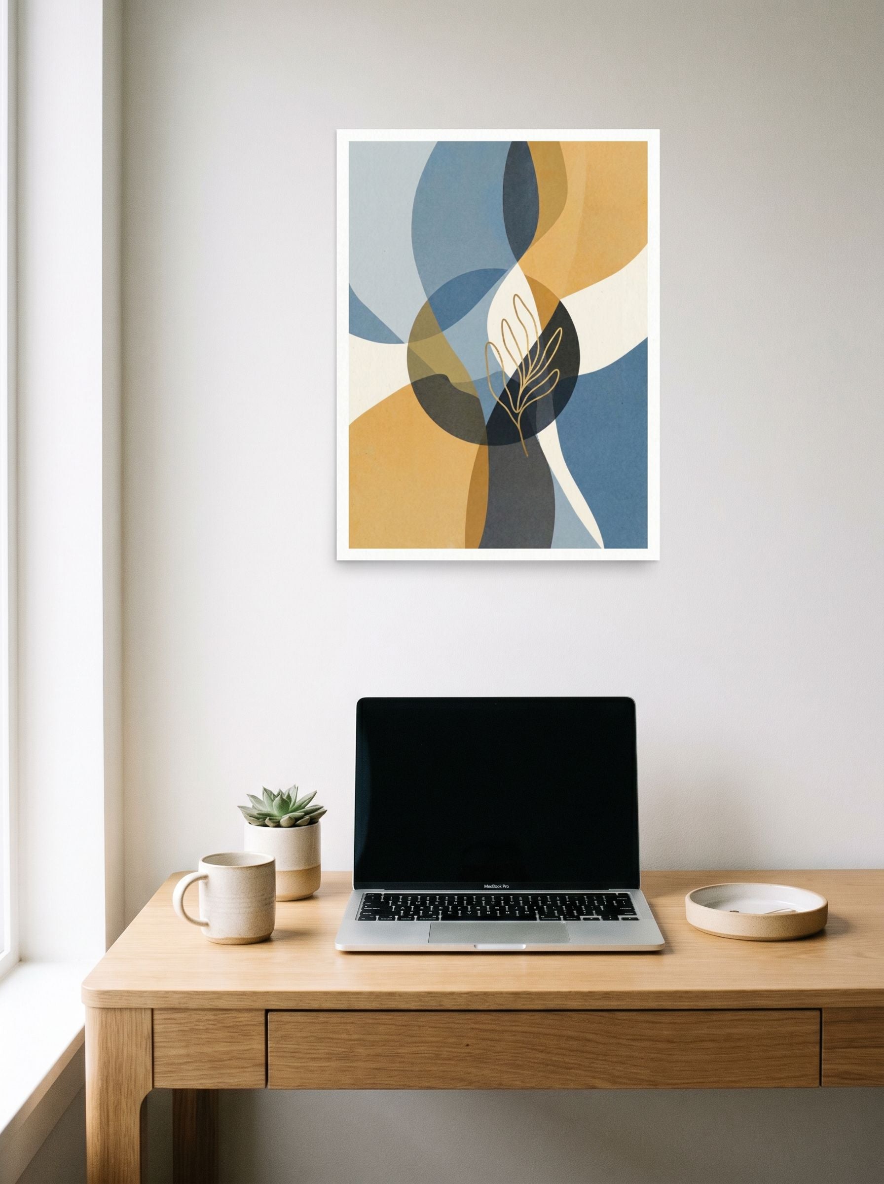 A 18x24 inch unframed paper Abstract art,Minimalism print of 'Serene Geometry' hanging above a worktable with a laptop.