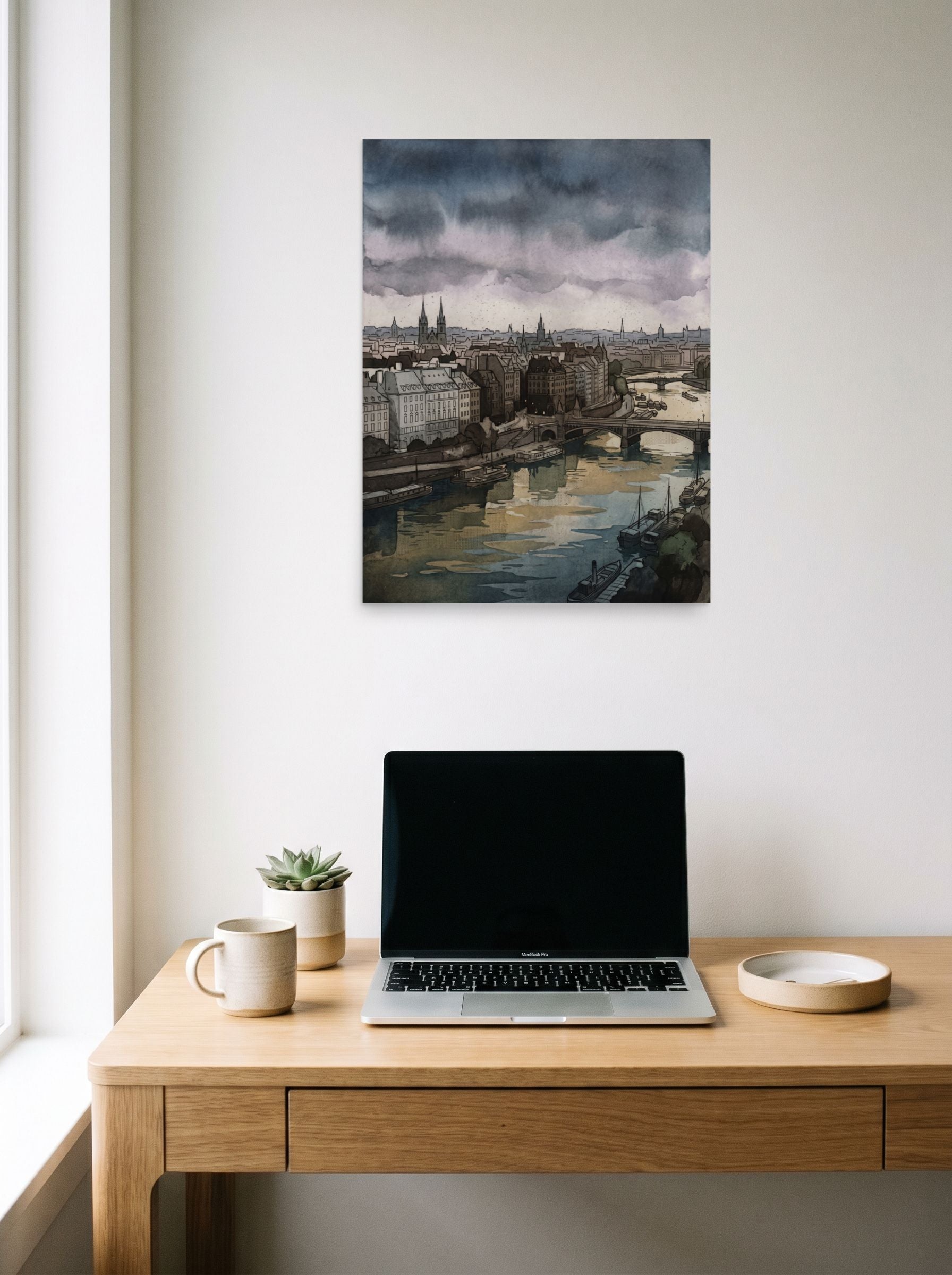 A 18x24 inch unframed paper Impressionism print of 'Twilight Over the Seine' hanging above a worktable with a laptop.