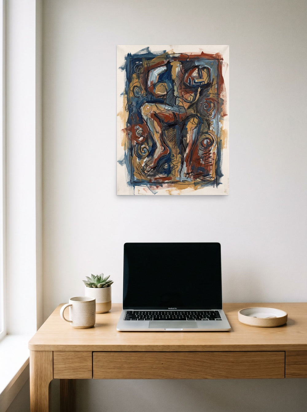 A 18x24 inch unframed paper Neo-expressionism print of 'Abstract Limbs in Sienna', hanging above a worktable with a laptop.