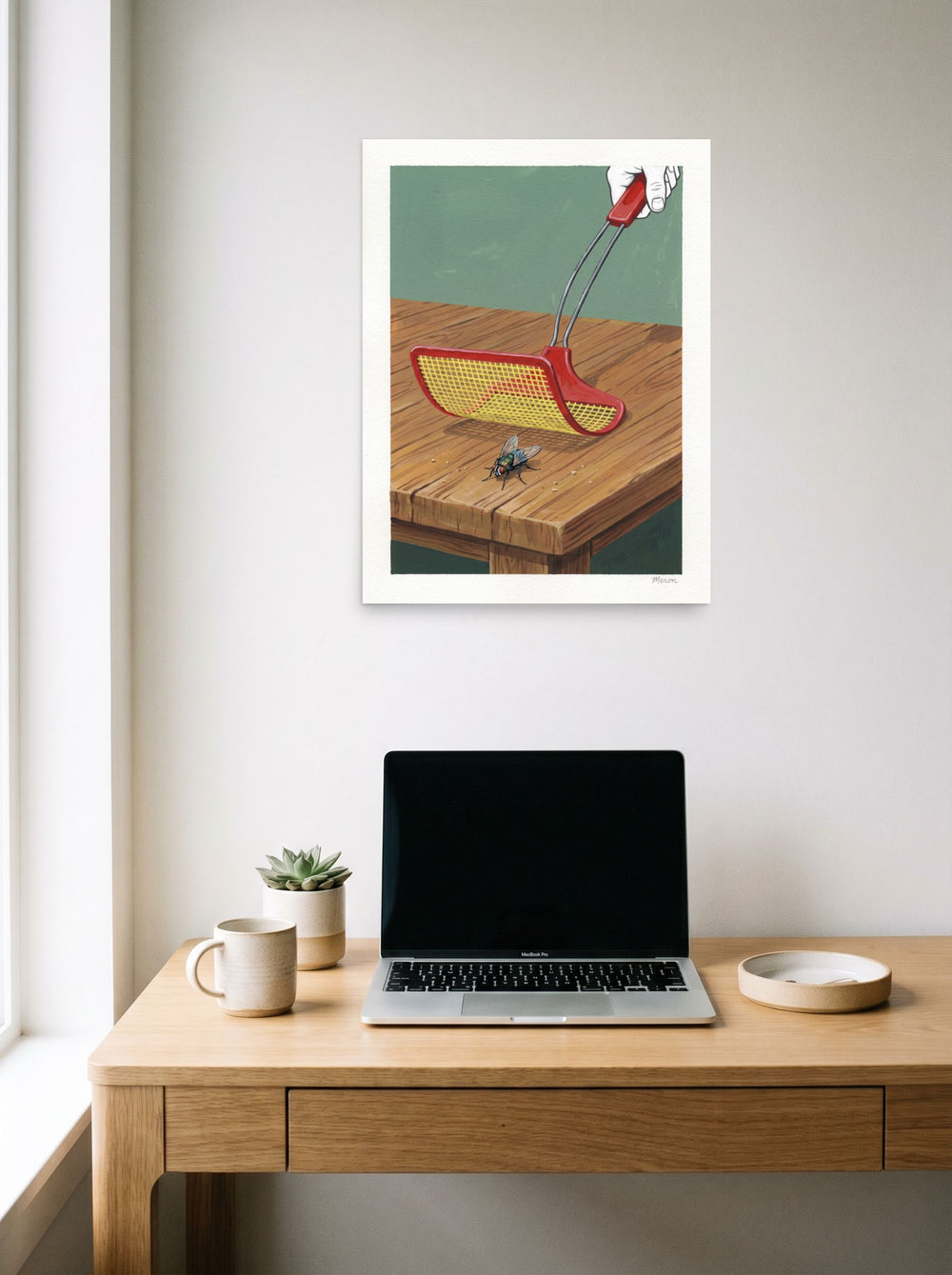 A 18x24 inch unframed paper version of 'The Impending Strike', Pop art wall art, styled above a home-office workspace.