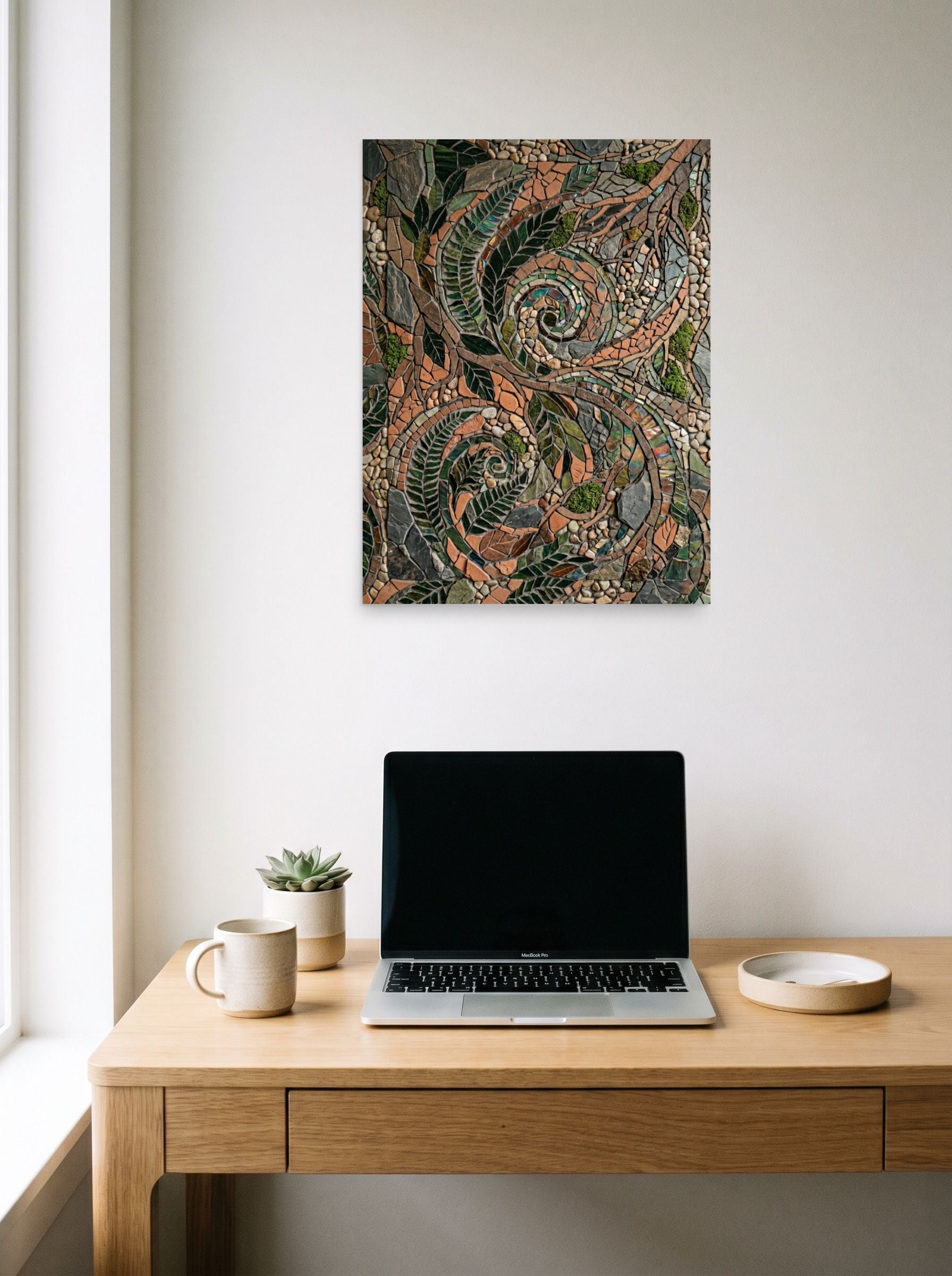 A 18x24 inch unframed paper Environmental art,Folk Art print of 'Fossilized Ferns' hanging above a worktable with a laptop.