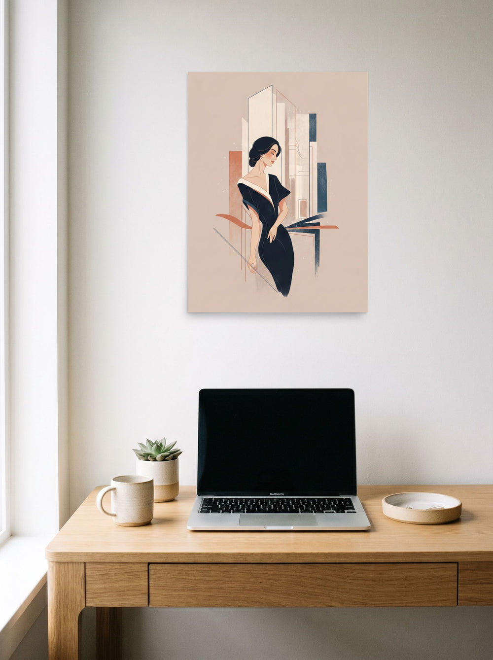 A 18x24 inch unframed paper Art Deco print of 'Midnight Chic' hanging above a worktable with a laptop.