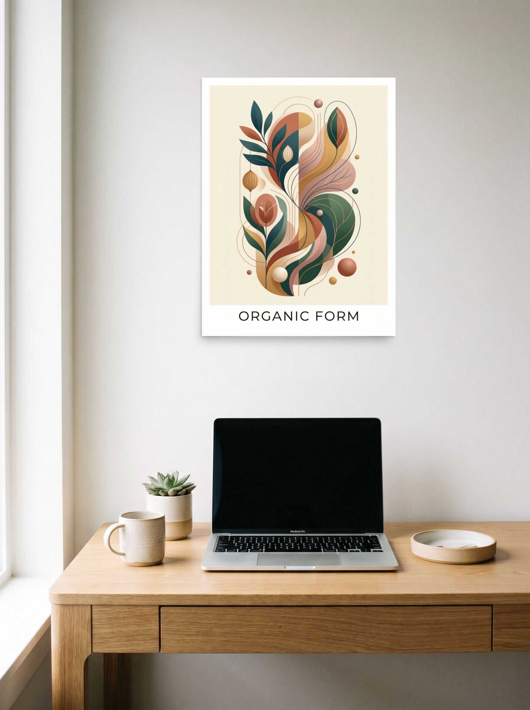 A 18x24 inch unframed paper Abstract art,Modernism print of 'Earthy Organic Form' hanging above a worktable with a laptop.