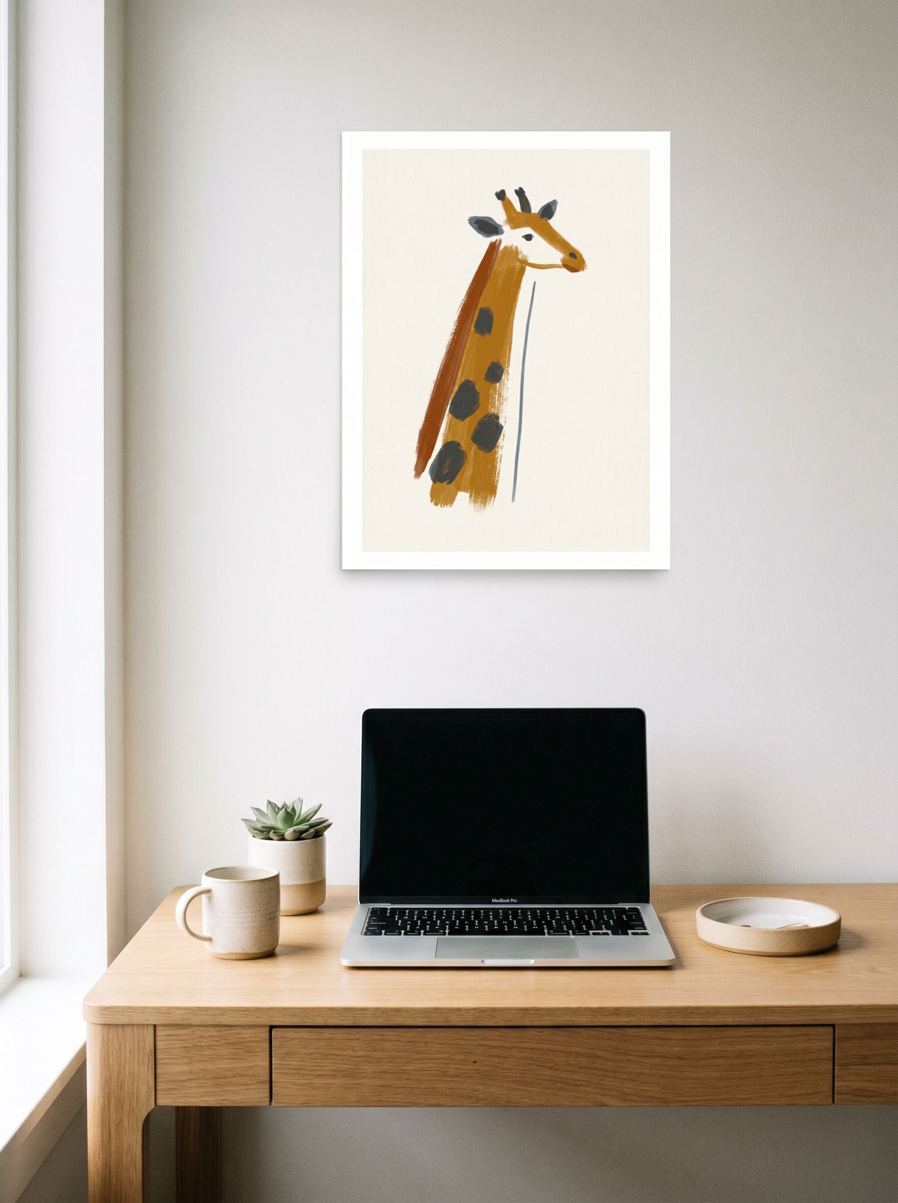 A 18x24 inch unframed paper Minimalism print of 'Modern Safari' hanging above a worktable with a laptop.
