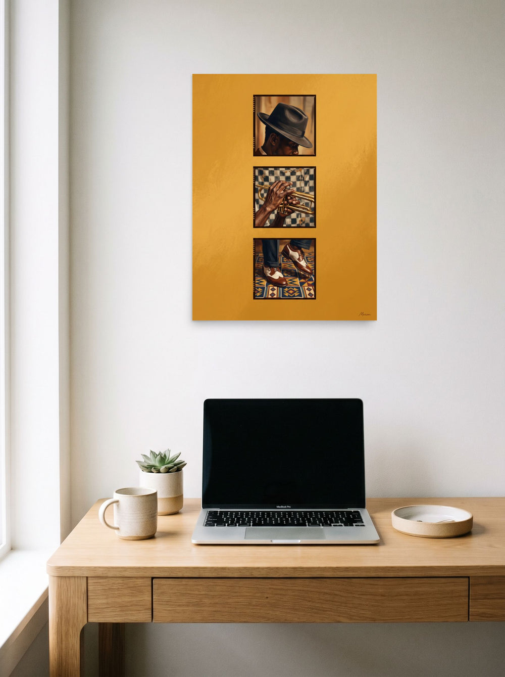 A 18x24 inch unframed paper Harlem Renaissance,Realism print of 'Triptych in Brass' hanging above a worktable with a laptop.