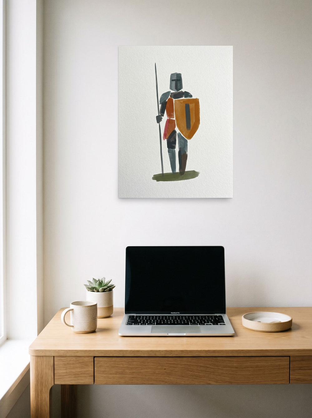 A 18x24 inch unframed paper Minimalism print of 'Abstract Guardian' hanging above a worktable with a laptop.