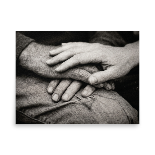 'A Lasting Touch' — a Art photography print. A black and white close up photograph of two older hands gently intertwined on a person's lap, perfect for adding warmth to a bedroom.