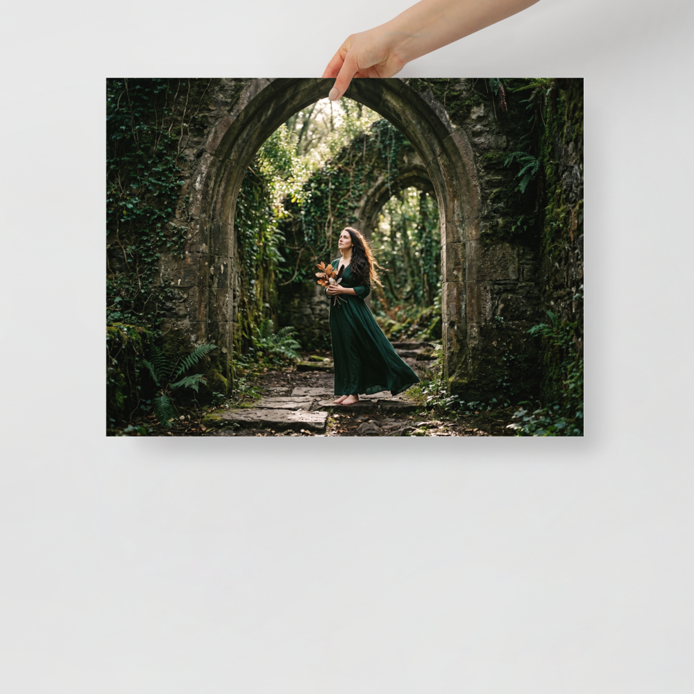 'The Forest Guardian' — a Art photography print. A photograph of a woman in a green dress standing barefoot under ruined stone arches in a forest, bringing a touch of fantasy and nature to a Bedroom.