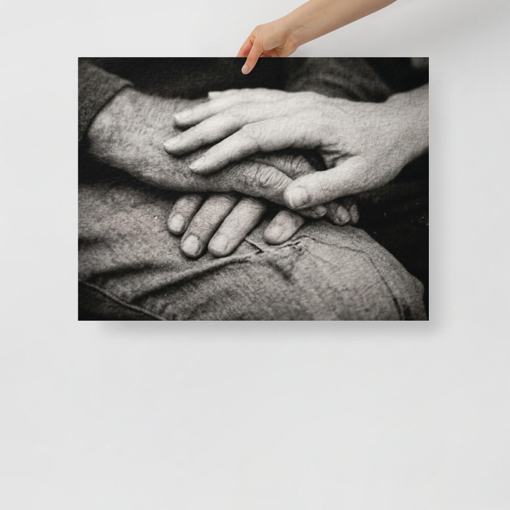 'A Lasting Touch' — a Art photography print. A black and white close up photograph of two older hands gently intertwined on a person's lap, perfect for adding warmth to a bedroom.