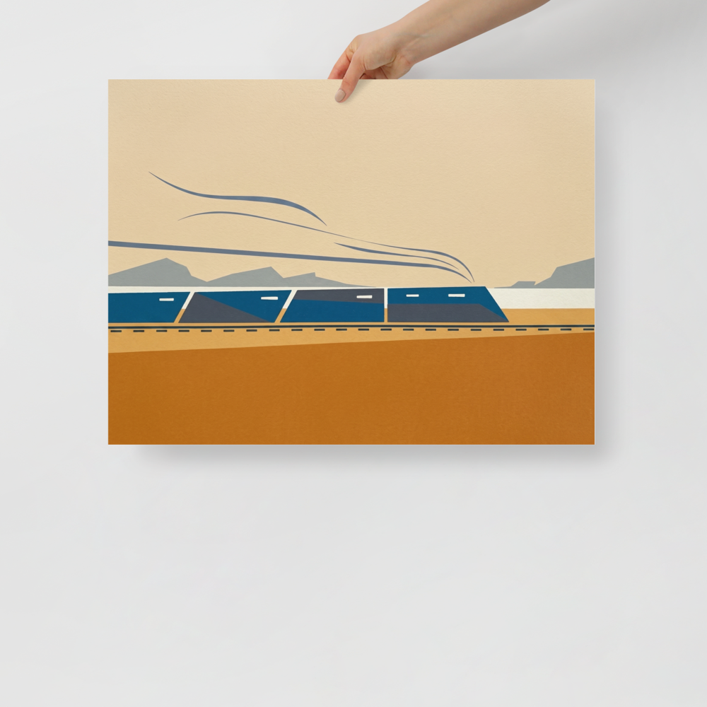 'The Coastal Express' — a Minimalism print. A modern minimalist graphic illustration of a blue train moving across an ochre and beige landscape with grey mountains in the background, ideal for an Office or Boy's Bedroom.
