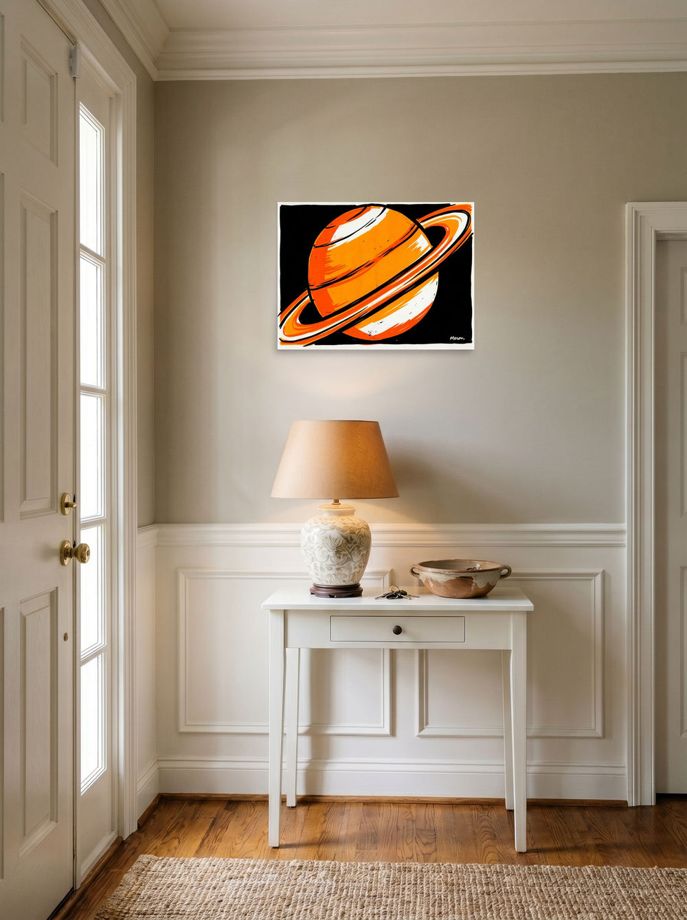 A 24x18 inch unframed paper Pop art print of 'Orange Orbit' hanging in an entryway near a console.