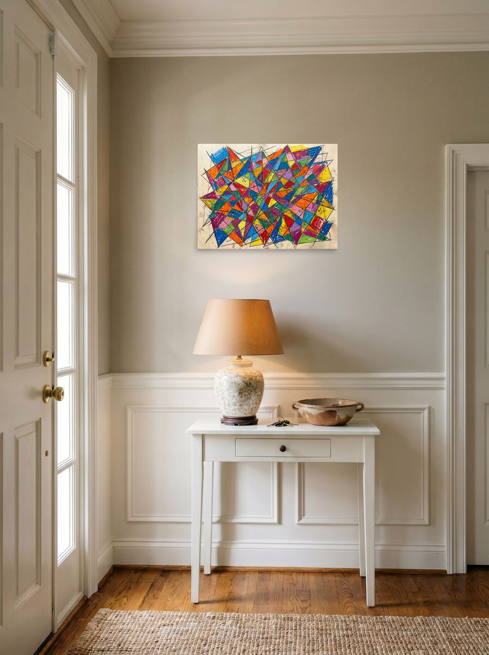 A 24x18 inch unframed paper Geometric abstract art,Cubism print of 'Prismatic Chaos' hanging in an entryway near a console.