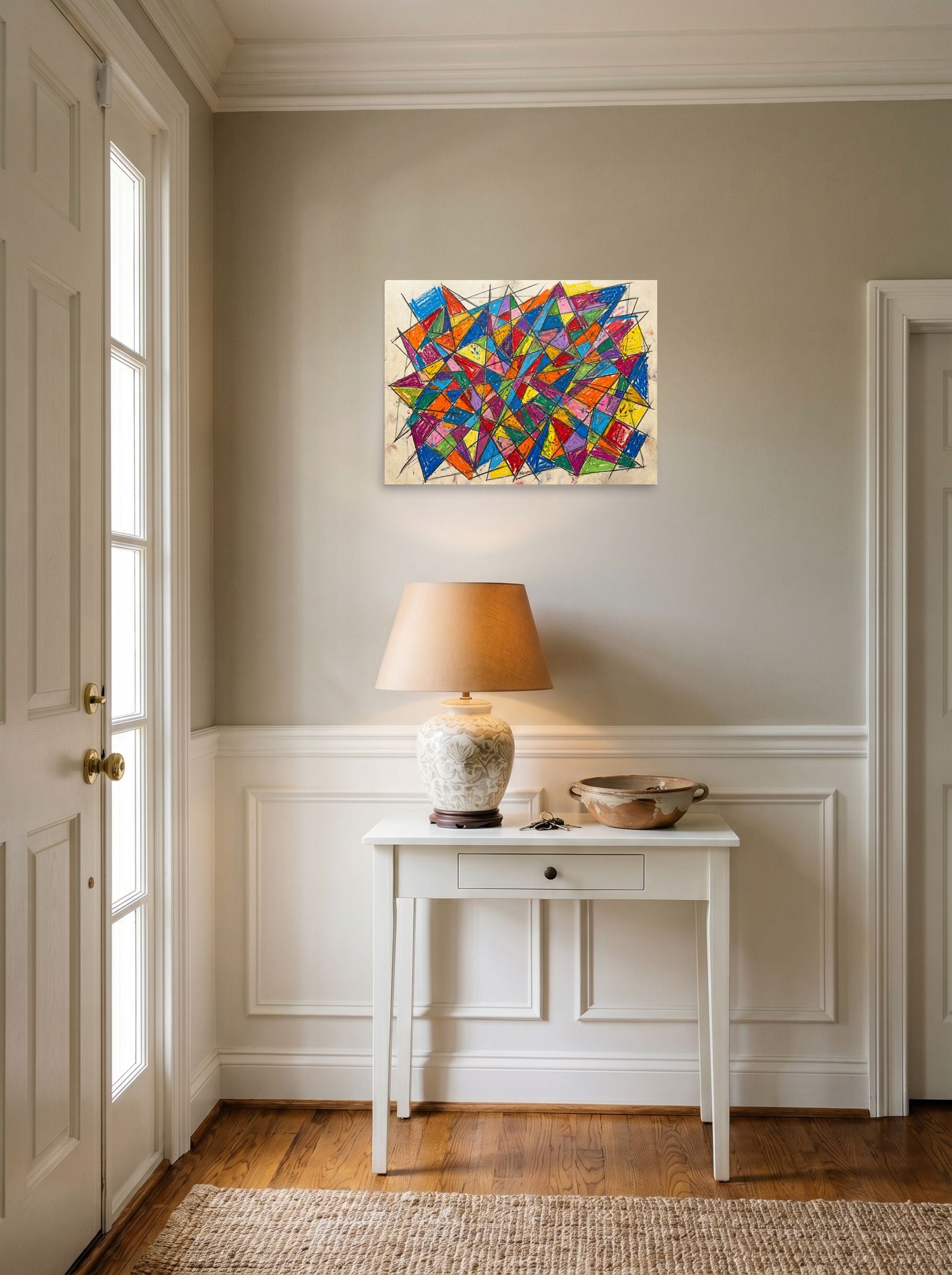 A 24x18 inch unframed paper Geometric abstract art,Cubism print of 'Prismatic Chaos' hanging in an entryway near a console.