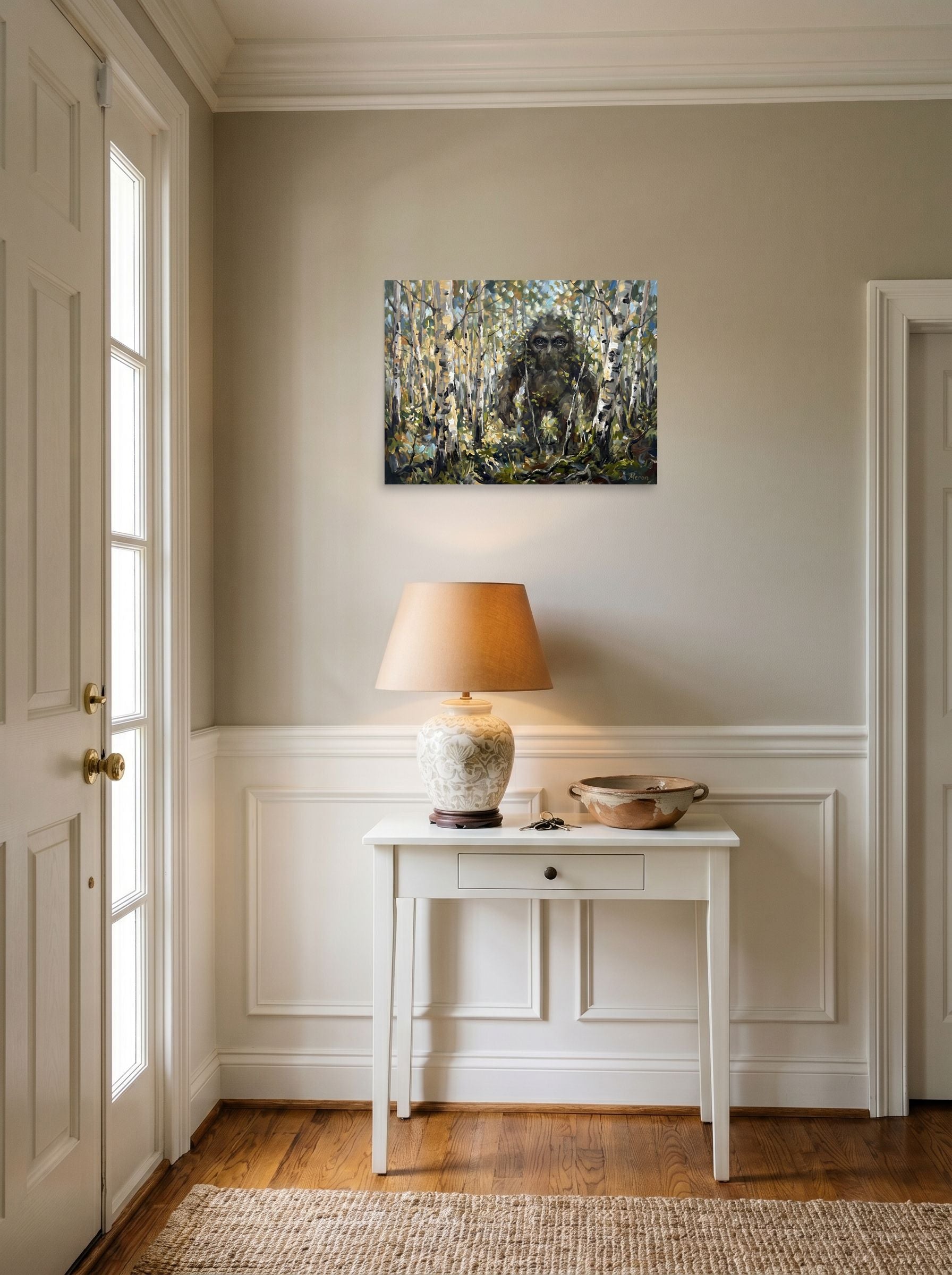 A 24x18 inch unframed paper Expressionism print of 'Forest Watcher' hanging in an entryway near a console.