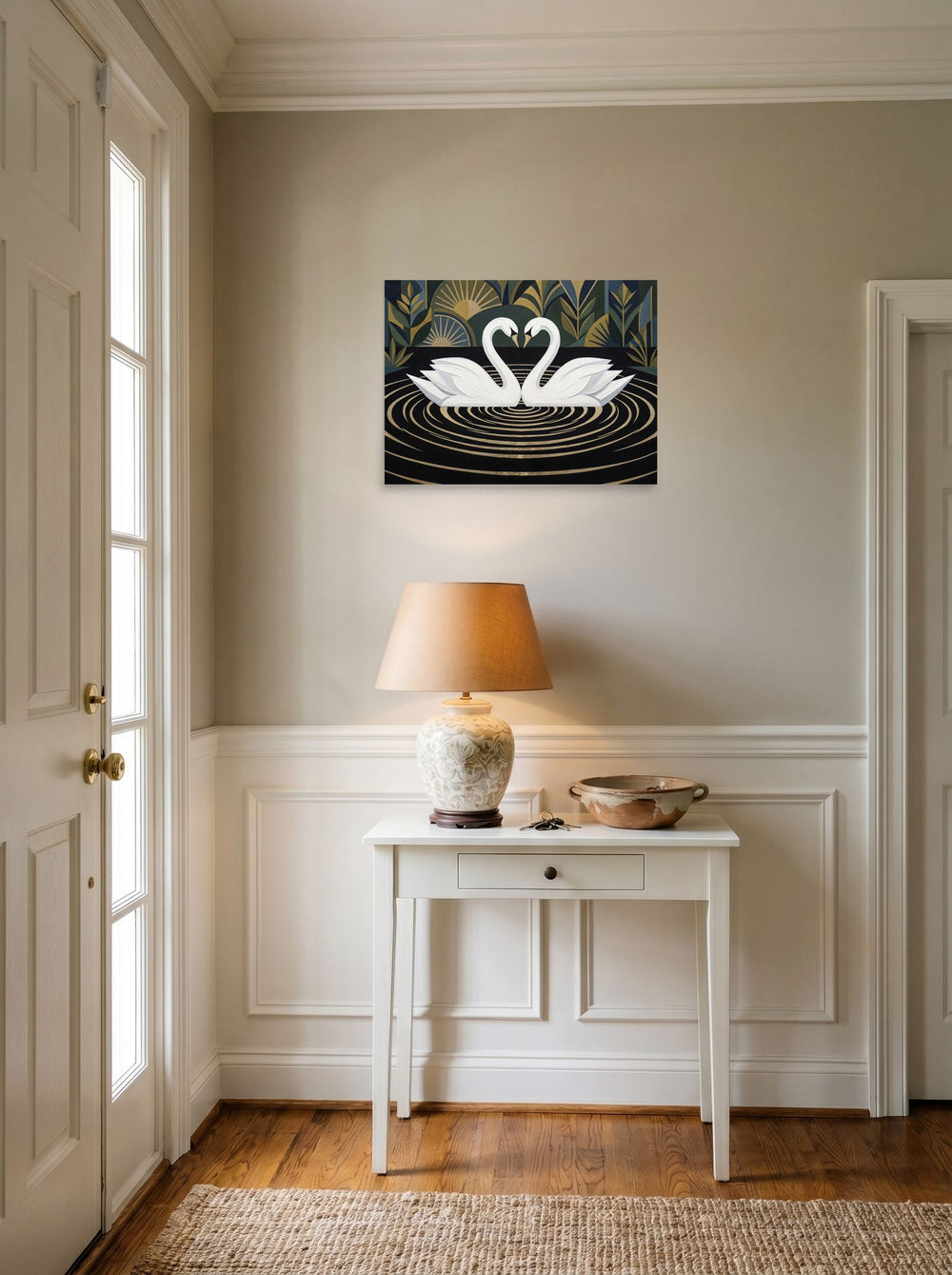 A 24x18 inch unframed paper Art Deco print of 'Deco Swans' hanging in an entryway near a console.